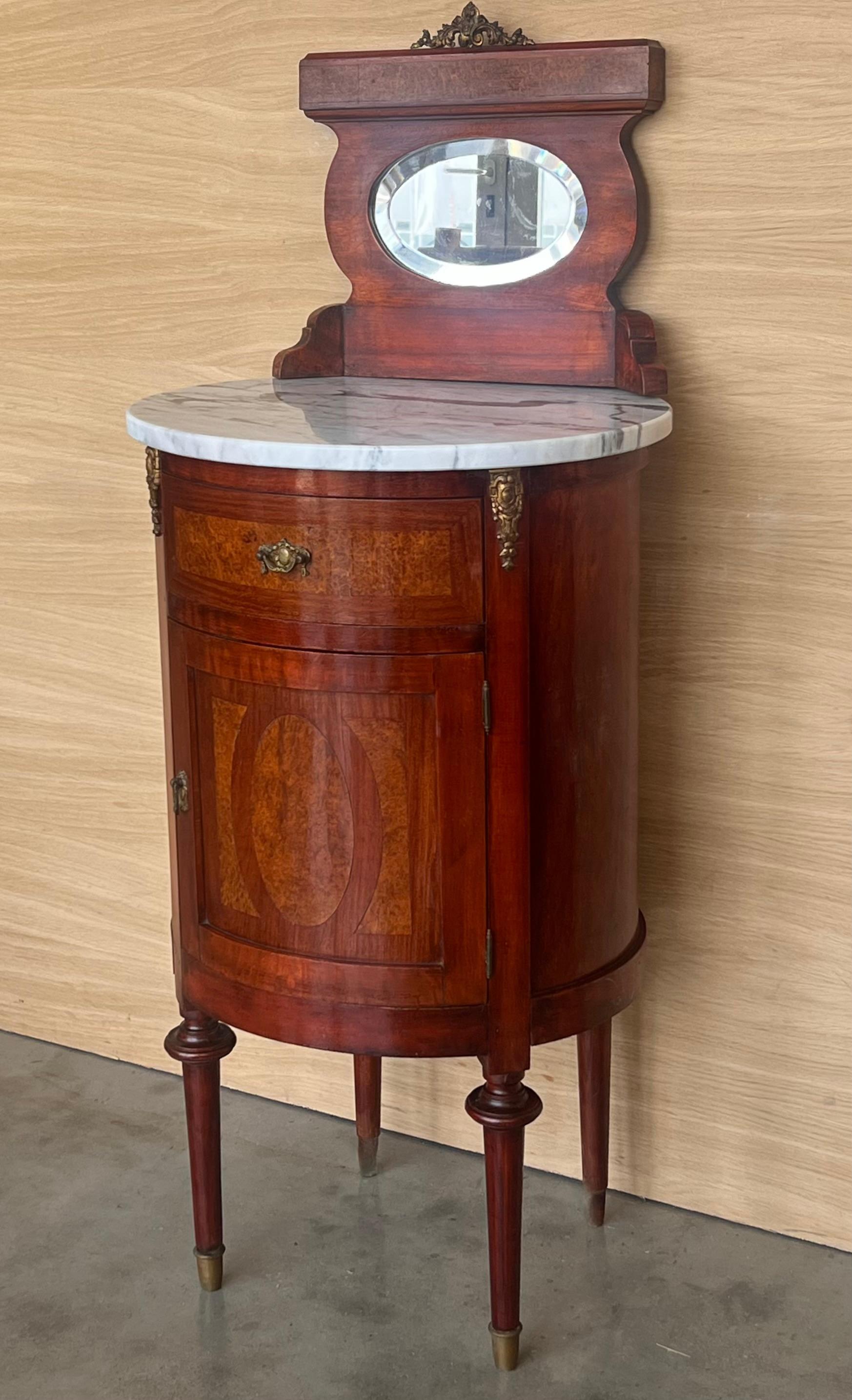 Louis XVI style pair of Marquetry nightstands with bronze crest one drawer and one compartment.
Originals handles and garniture.
Completely restored.

Total height : 46.45 in
