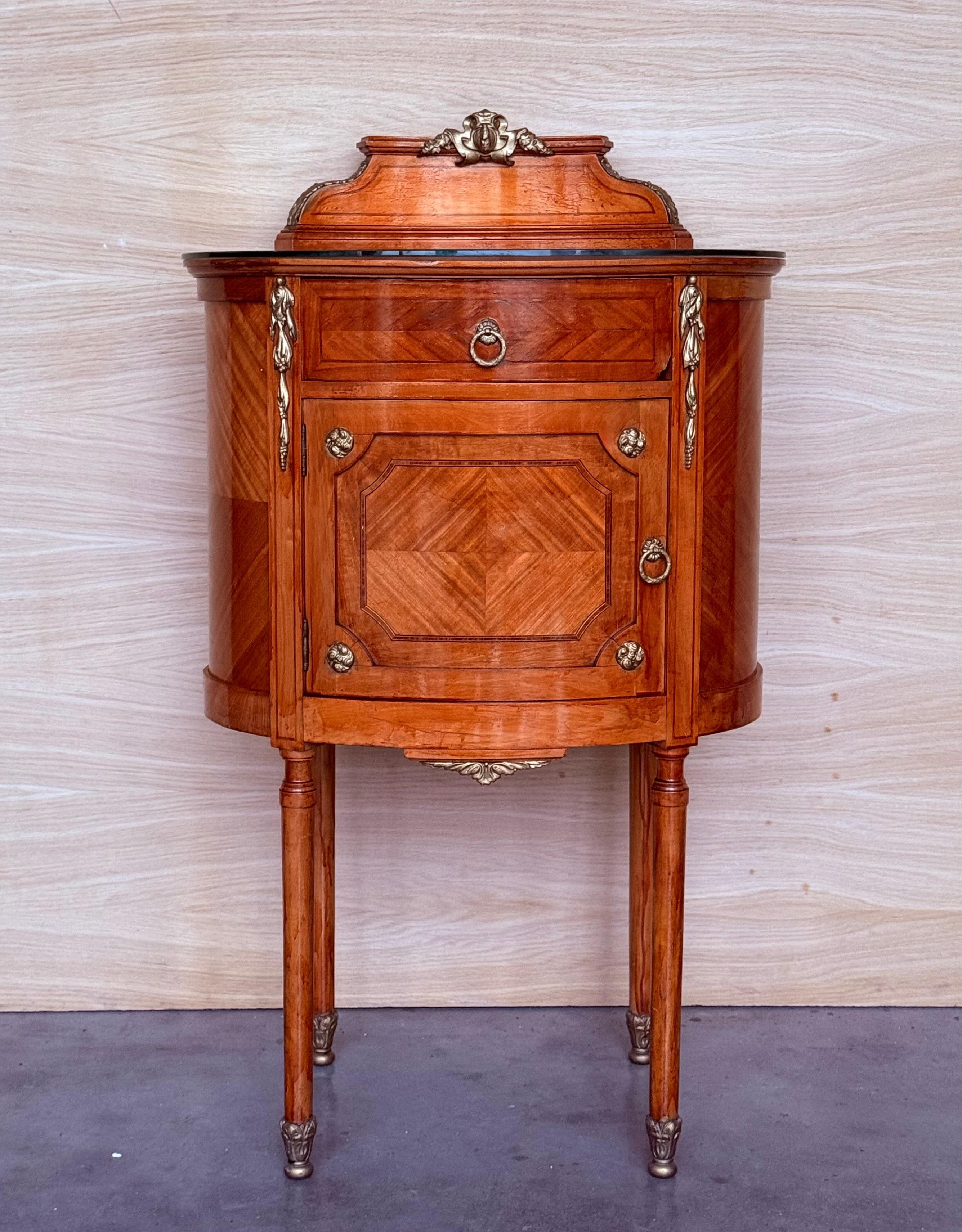 Louis XVI style pair of Marquetry nightstands with bronze crest one drawer and one compartment.
Originals handles and garniture.
Completely restored.

Height from the floor to the top : 32.87 in
