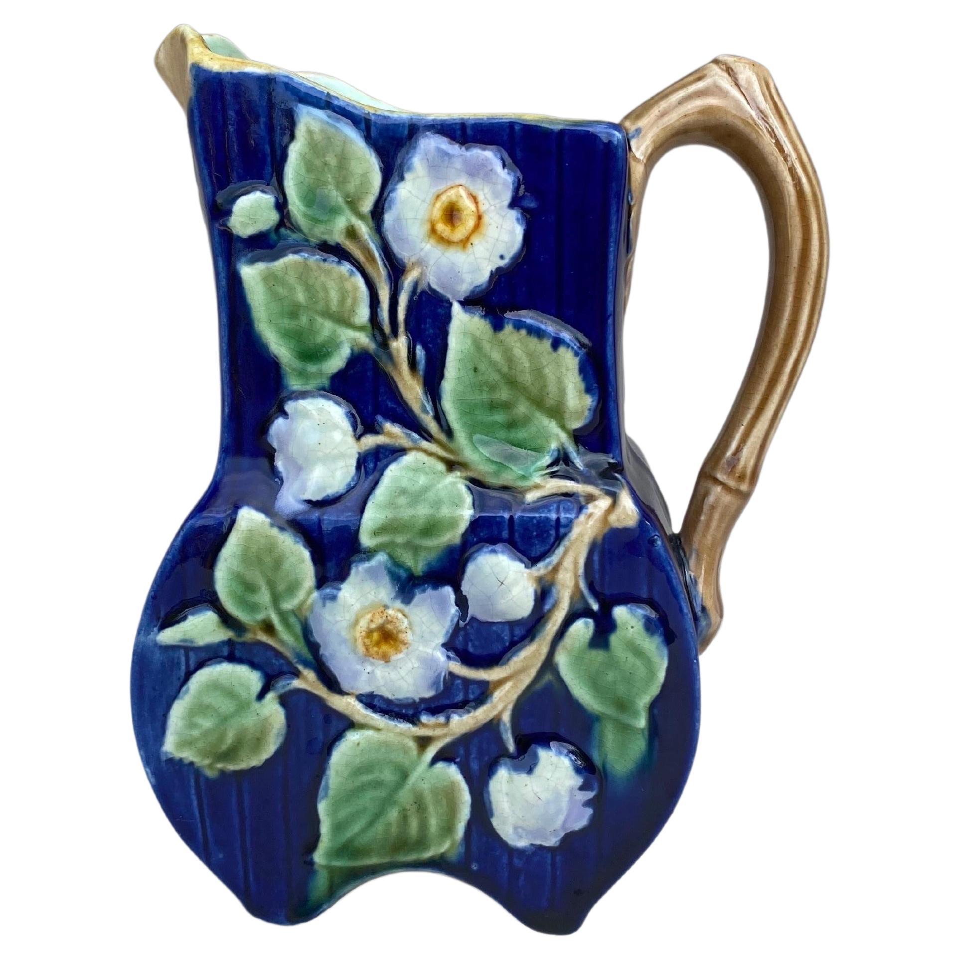 19th Century Majolica English Majolica White on a cobalt background flowers pitcher.