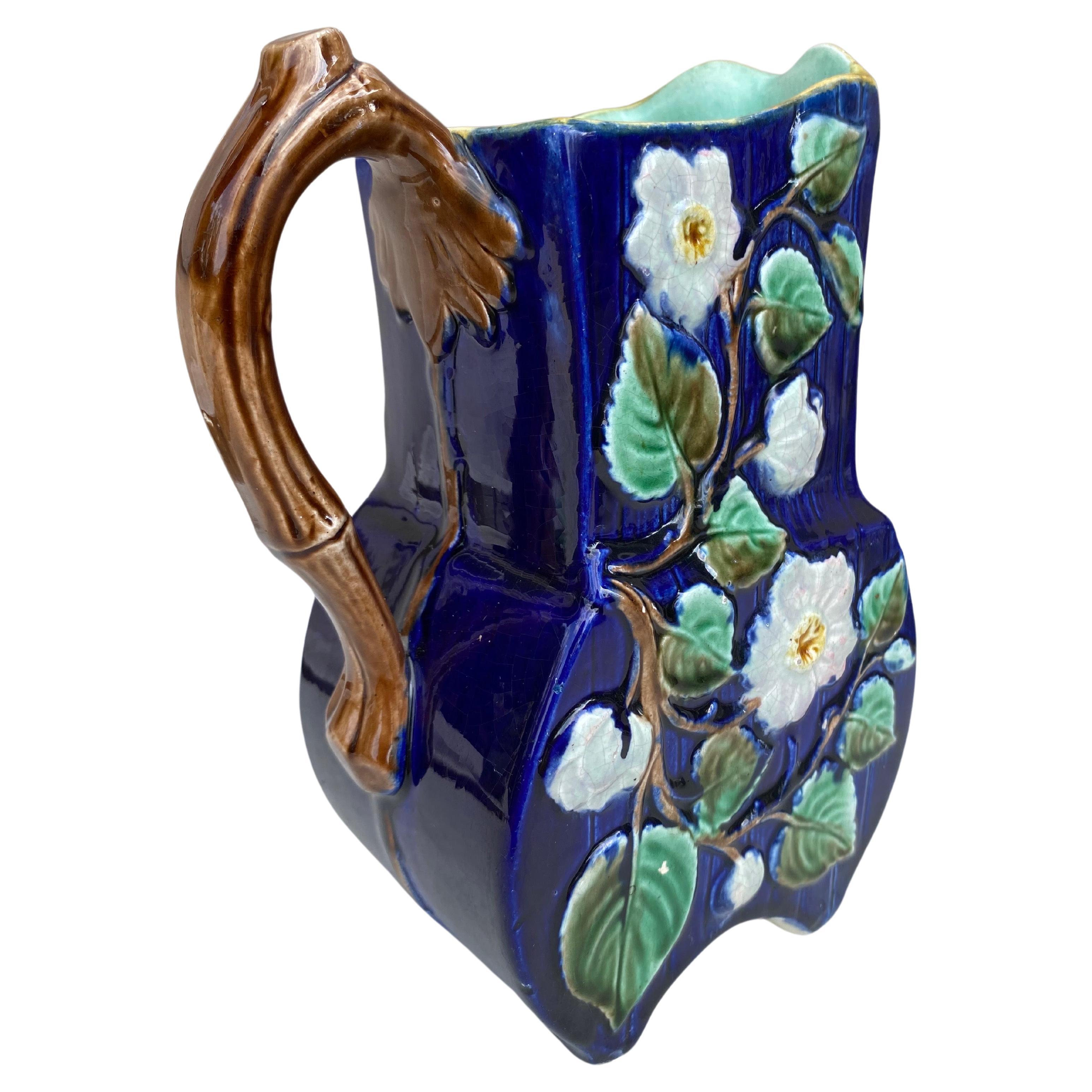 19th Century Majolica English Majolica white on a cobalt background flowers pitcher.