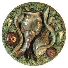 Assiette murale en majolique du 19ème siècle représentant des poissons et des anguilles de Palissy de Jose Alves Cunha