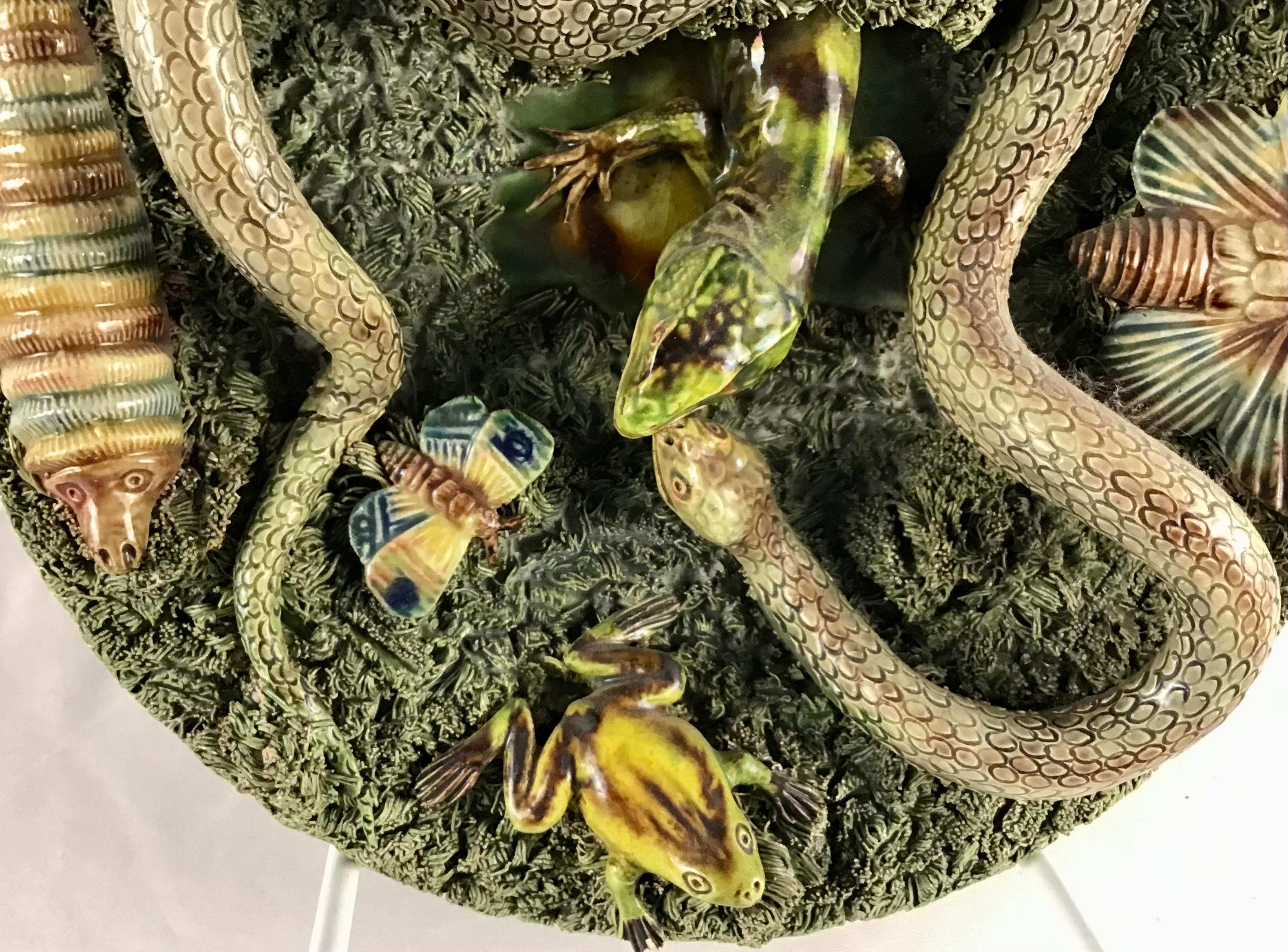 Antique 19th century Portuguese Majolica Palissy style plate with large snake and large lizard searching through mossy tuft, signed Jose Alves Cunha (Caldas da Rainha) with snake, worm, caterpillar, butterfly, frog and lizard. Impressed mark on back.