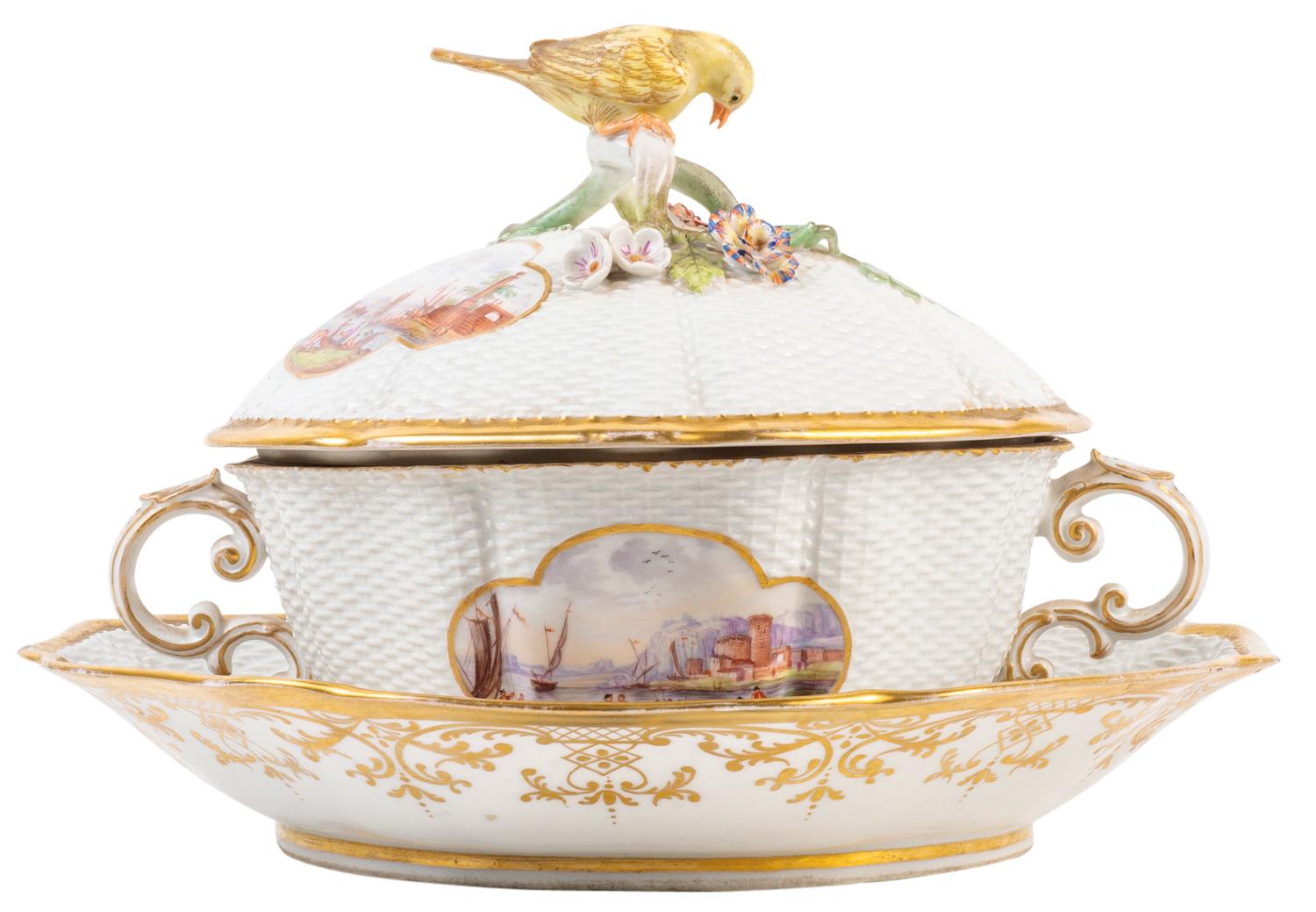 A good quality 19th century Meissen two handled lidded tureen, the lid having a yellow bird finial above a green branch handle, white wicker ground with painted inset panels to the lid and tureen of boating scenes.
Blue crossed swords to the