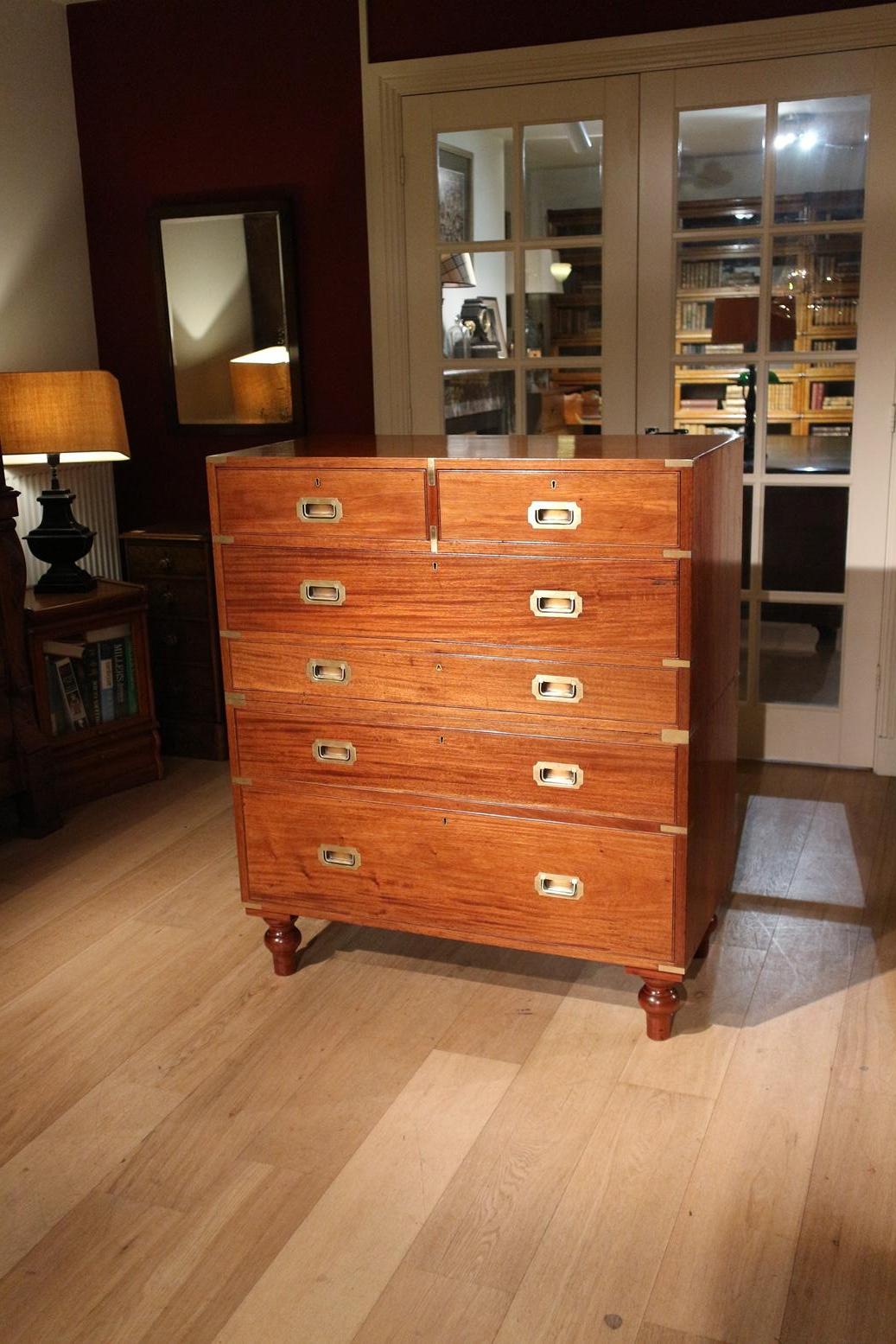 Antique mahogany Campaign chest of drawers with desk drawer. Entirely in perfect condition. The desk drawer has storage compartments and a small secret drawer. Which is almost impossible to find

As is usual with a campaign chest of drawers, the