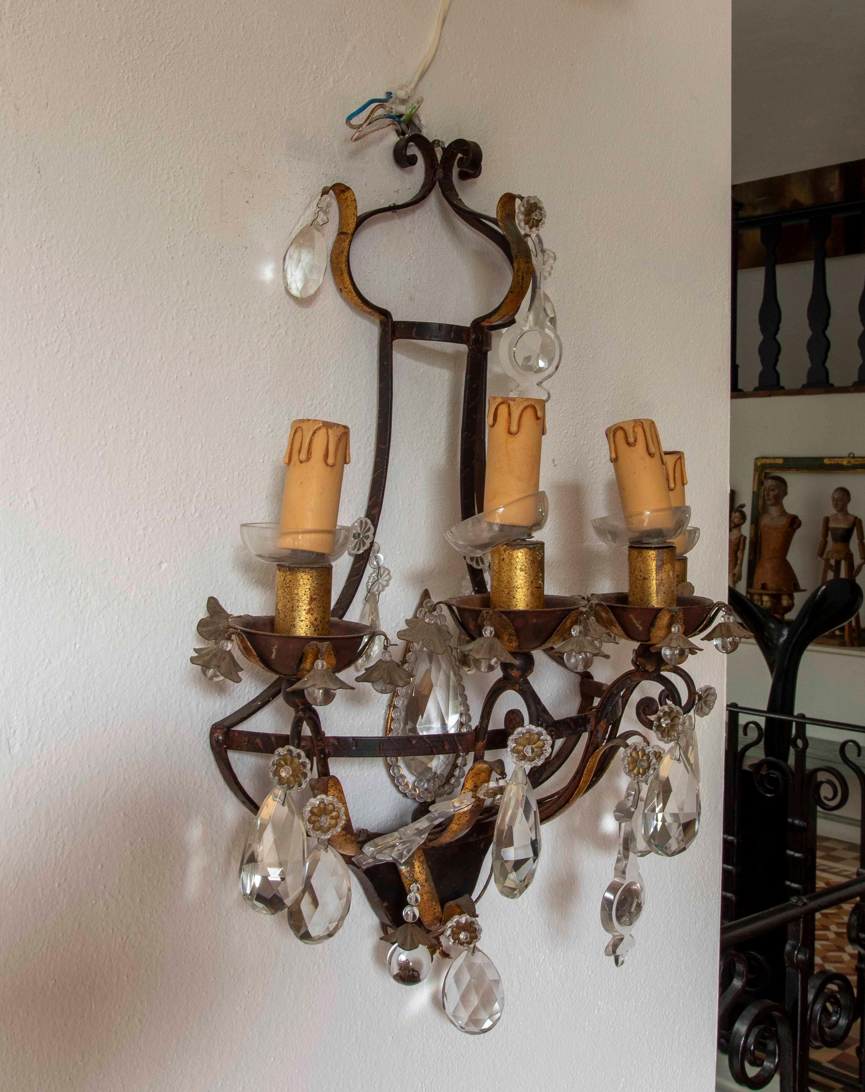 Italian 19th Pair of Antique Wrought Iron Wall Sconces with Cut Crystals For Sale