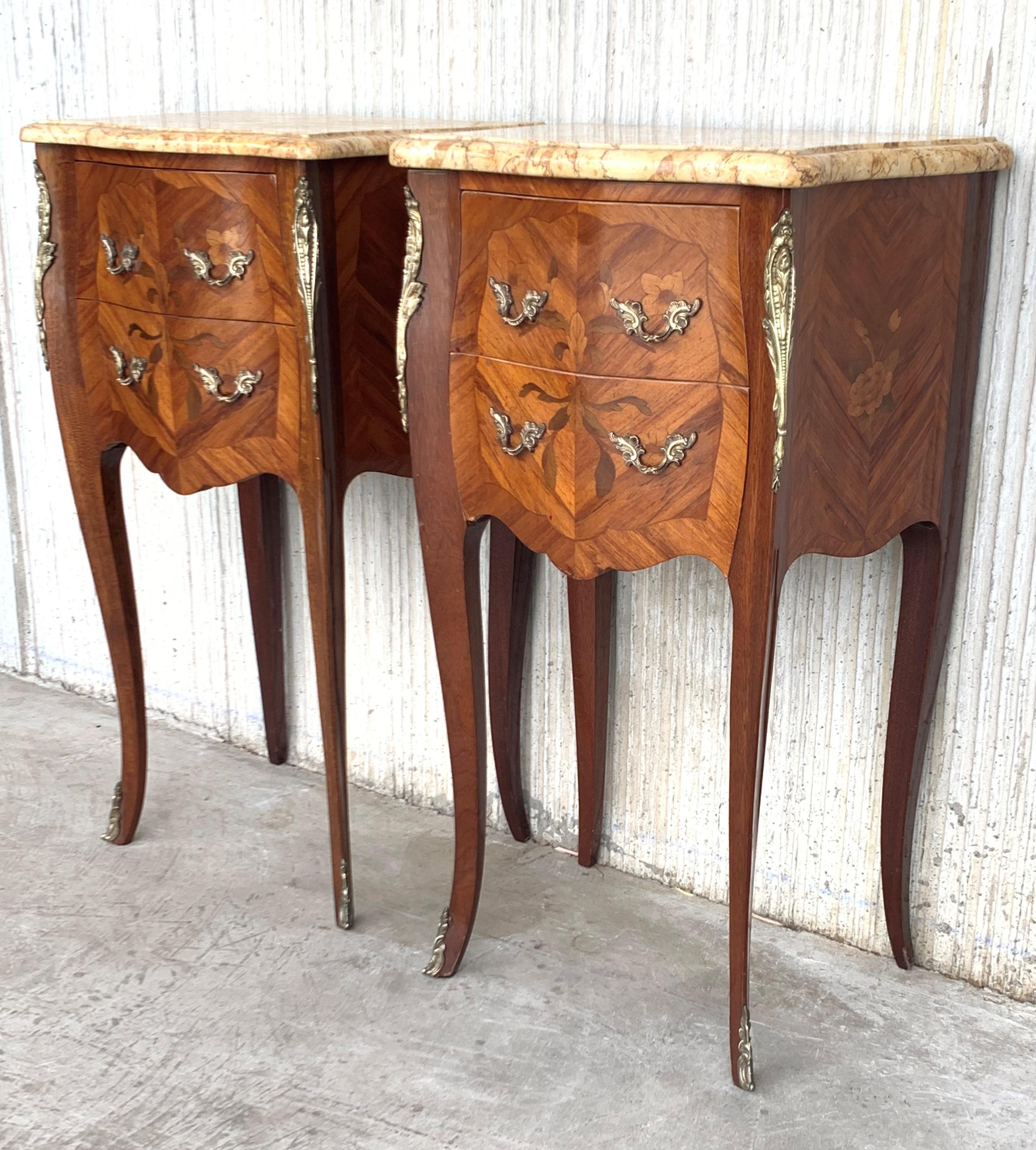 19th Lovely Pair of French Marquetry Nightstands with Roses and Marble Tops
Pair of beautiful French marquetry marble-top commode nightstands with bronze ormolu mounts and original beautifully veined contoured and beveled marble tops. Fine veneering