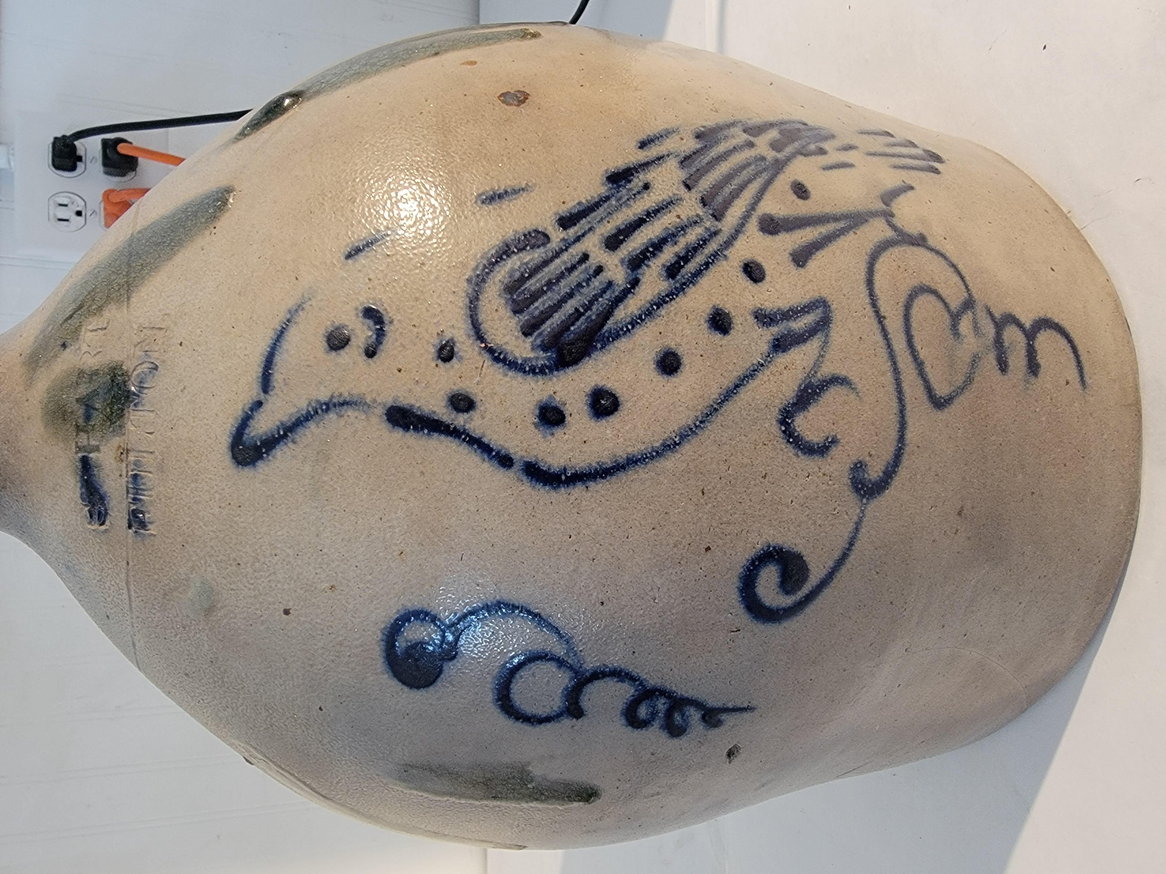 Original hand decorated stoneware jug with folky exaggerated bird. Great condition. Glaze drip on the sides. This jug is a rare treat and has amazing wear from age and use. 

Lettering on front of Jug 