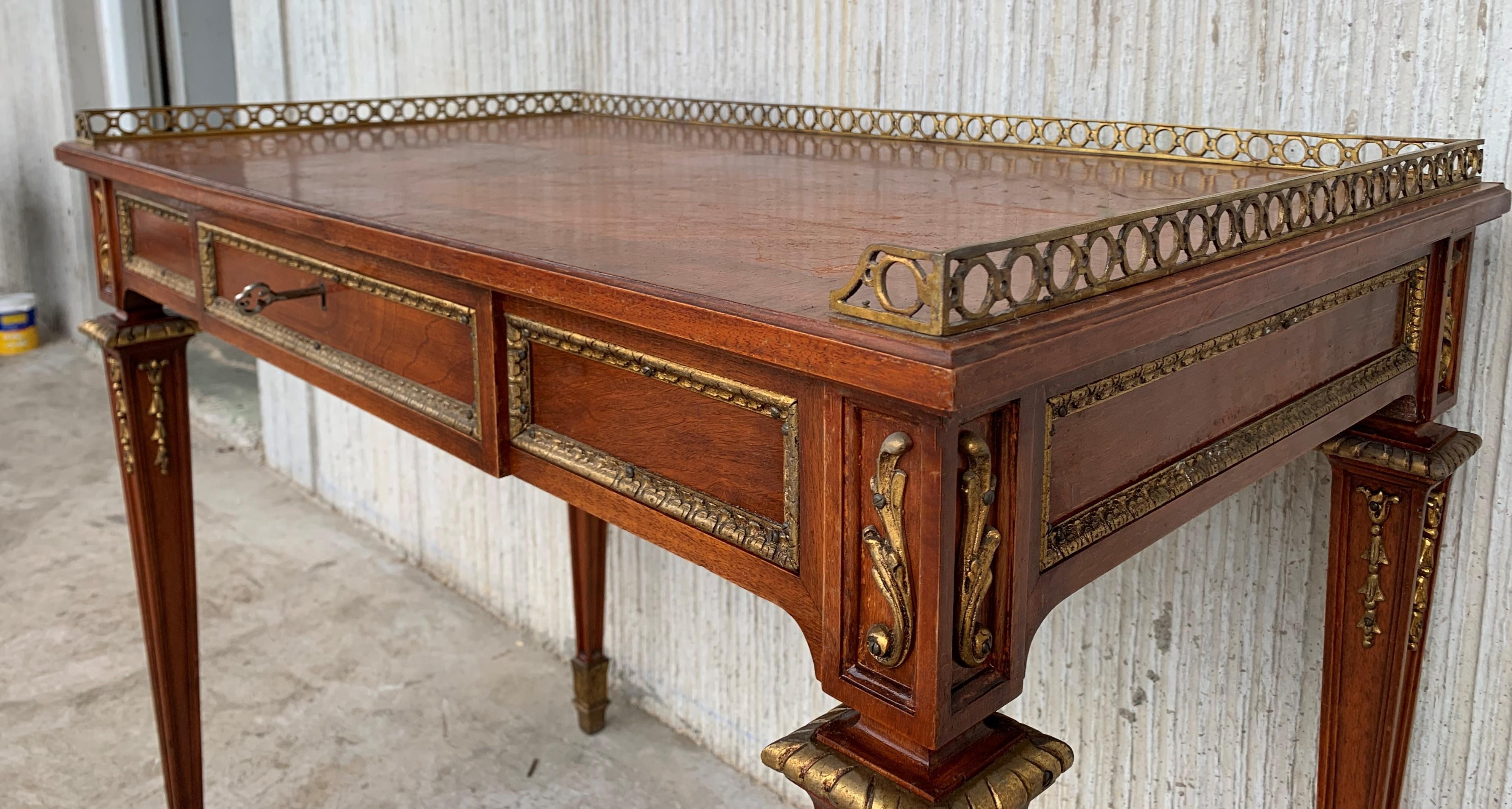 This important writing table is after Jean-Henri Riesener, perhaps the most important furniture maker working in Paris during the reign of Louis XVI. The desk thus demonstrates a curious history: it is a desk in a distinctly French style, after