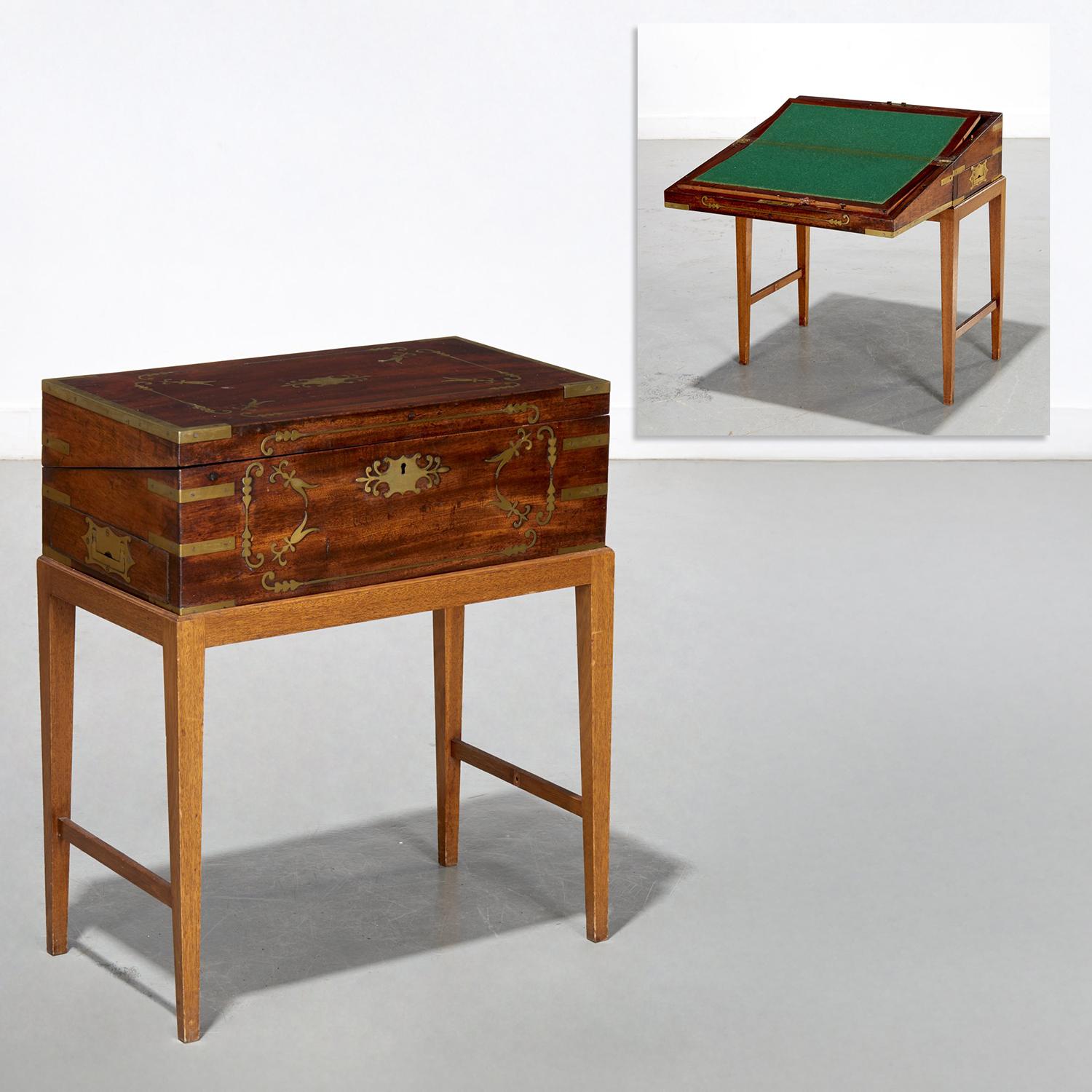 Regency Brass-Inlaid Portable Writing Desk on Later Stand, with Secret Drawer, Possibly by Thomas & William Lund

A fine English Regency period portable writing slope, early 19th century, crafted in figured mahogany with elaborate brass inlay,