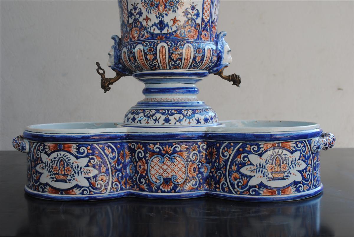 19th Rouen style Faience ribbed wall cistern and basin with decoration heads, carrying by 2 times inscription Pinxit Anno 1738, 19th century.
