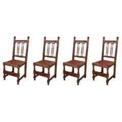 19th Set of Four Spanish Carved Chairs with Leather Seat and Back