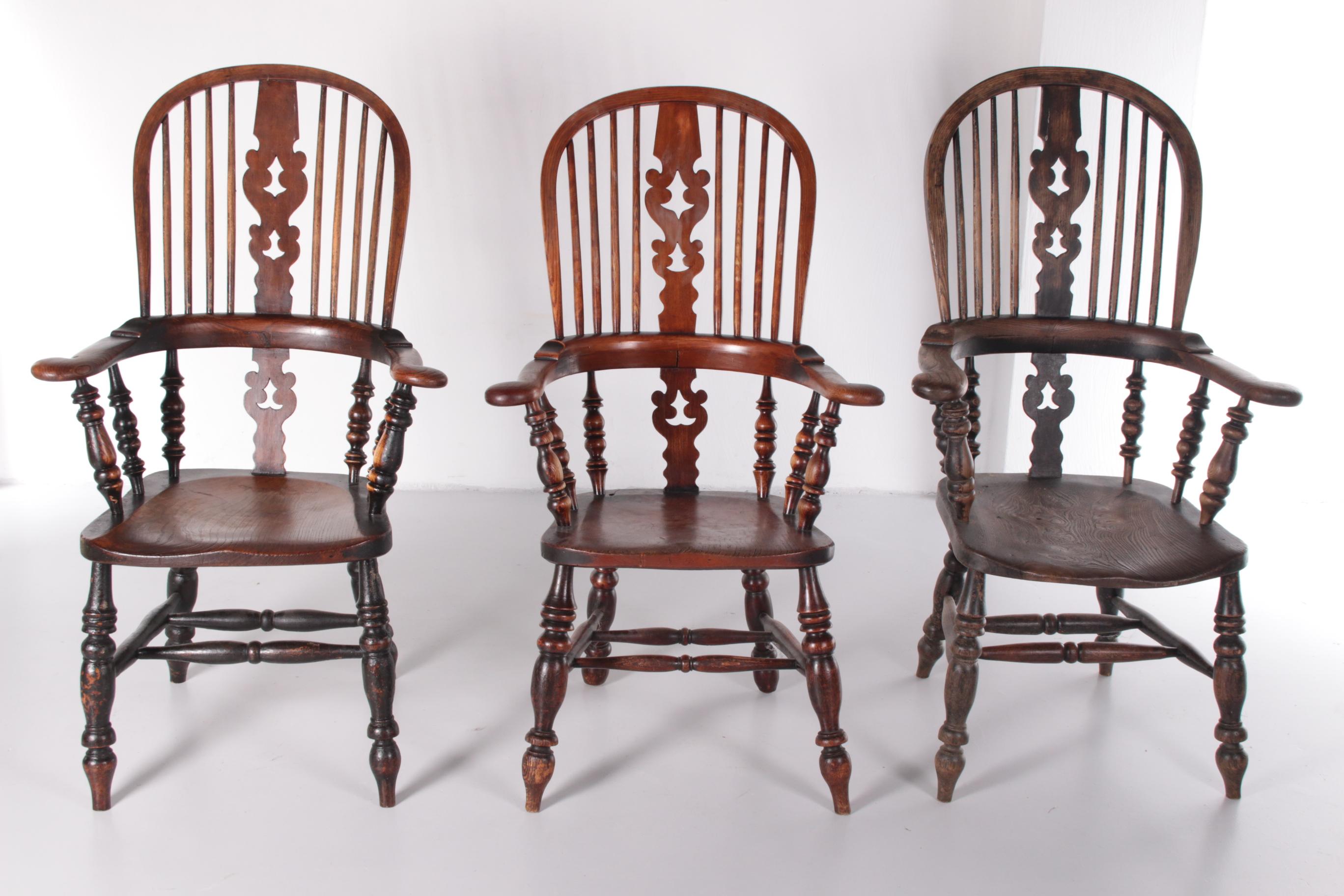 A well matched pair of 19th century yew and elm seated high back windsor chairs this is a quintessential Nottinghamshire design.

These models were designed around 1840 and made around 1900.

The patina is beautiful and robust, these chairs have