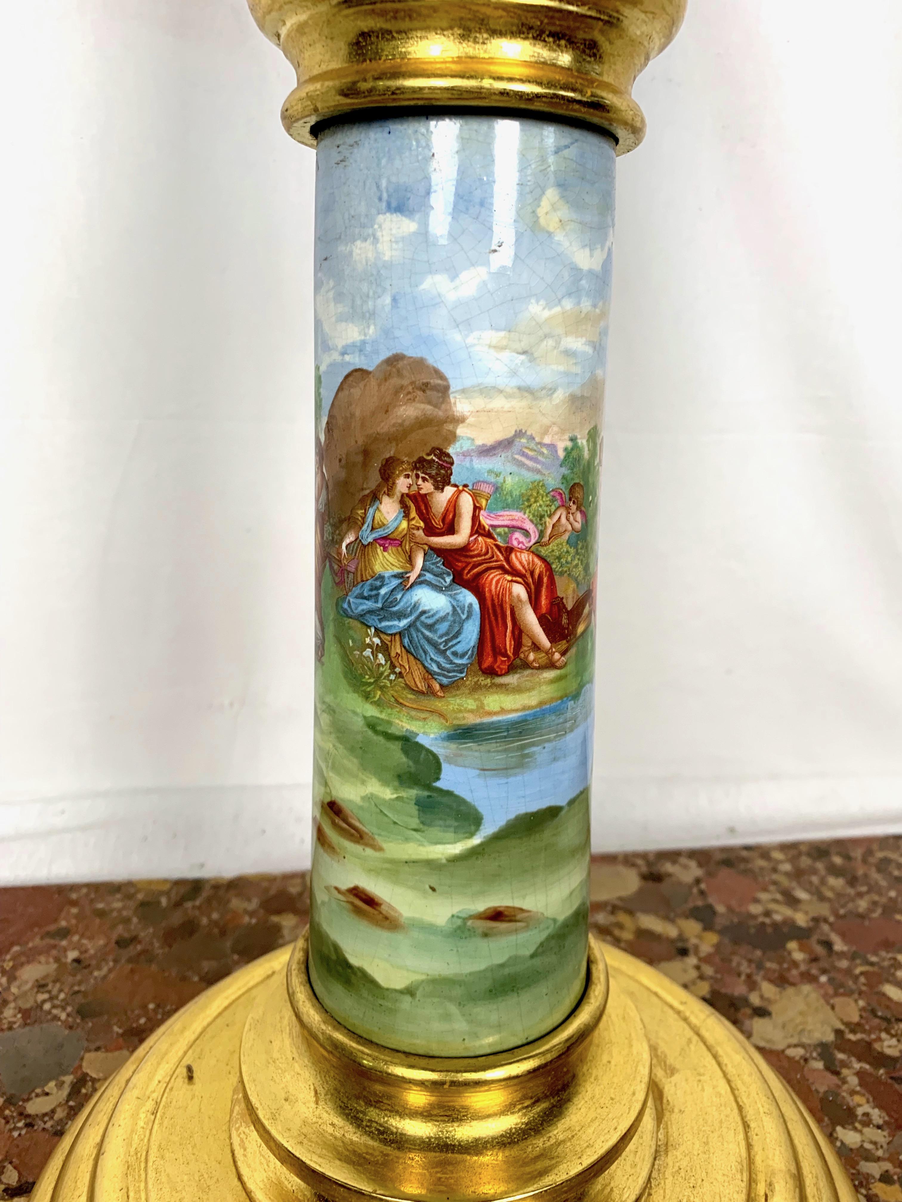 This outstanding pedestal beautifully exhibits the style and grace of the famed Sèvres porcelain manufactory. This exceptional piece features a lustrous light blue base, which provides the perfect background for the intricate gilt painting depicting