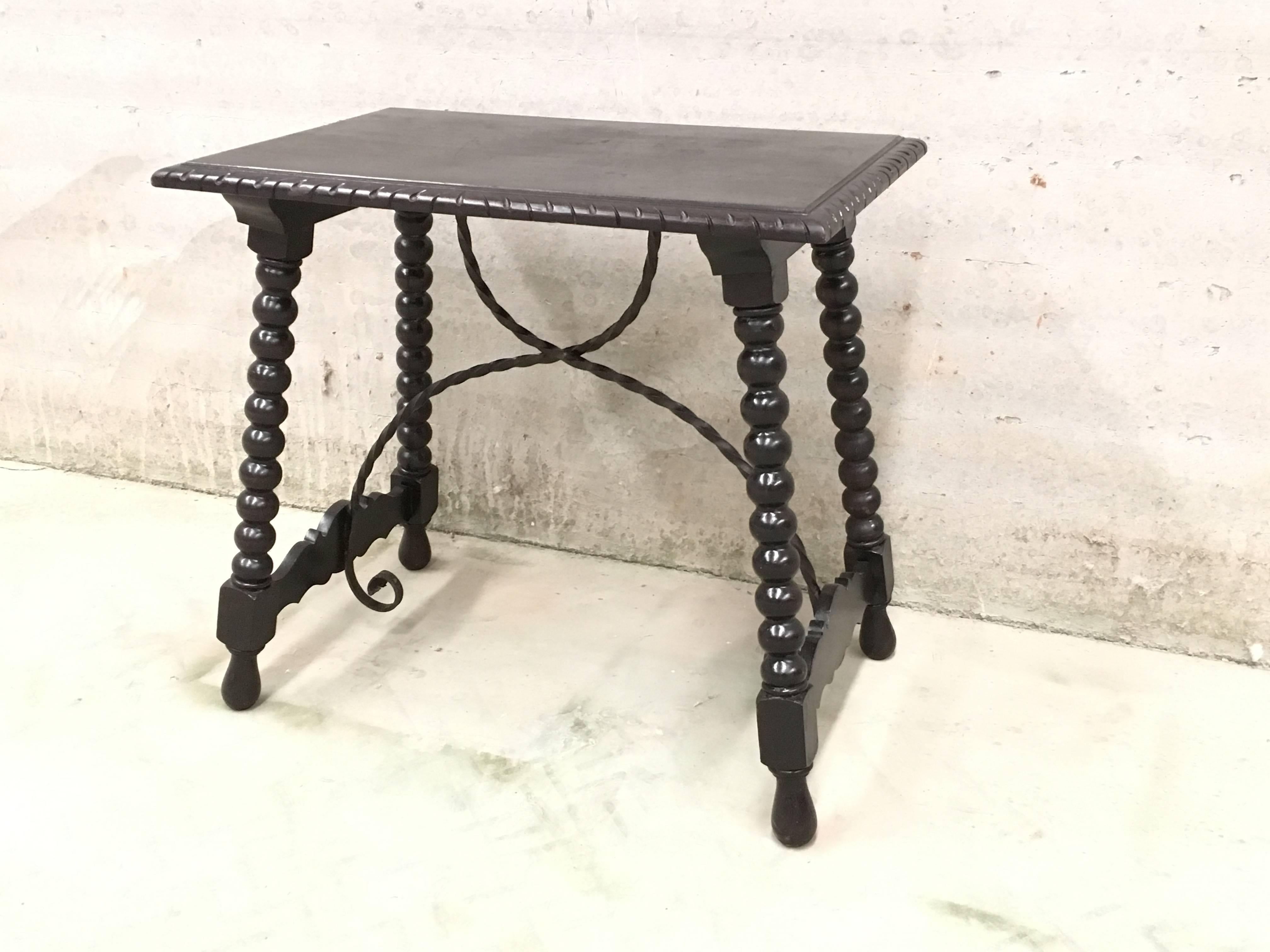 Renaissance 19th Spanish Baroque Side Table with Iron Stretcher and Carved Top in Walnut