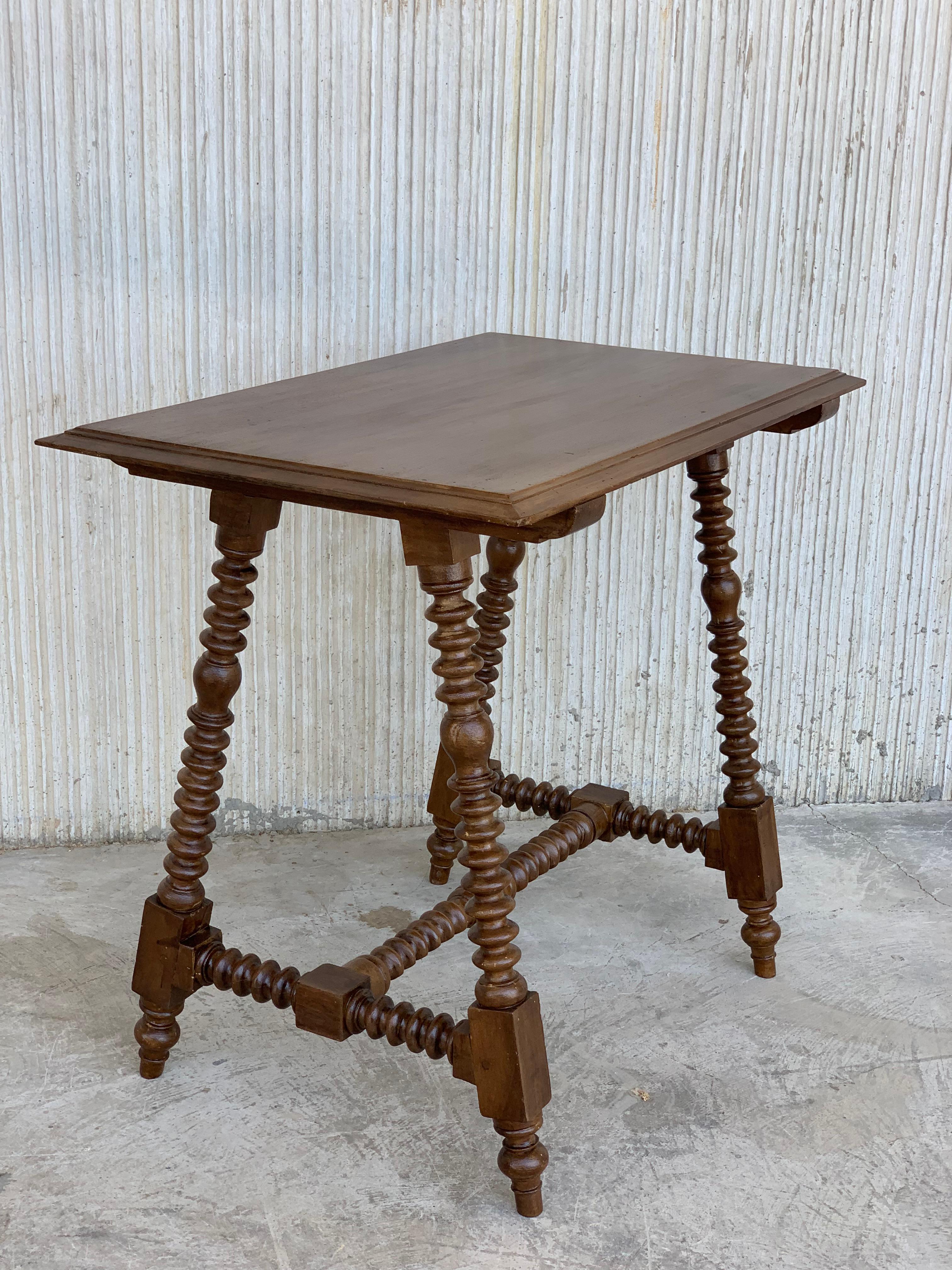 19th century Spanish Baroque ebonized side table with wood stretcher and top in walnut.