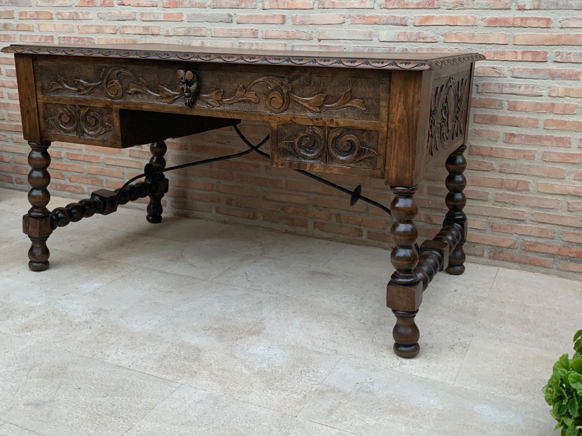 Handsome oak library piece that can be used as a desk or Work table. Made of oak having carved gadrooned edges. A stretcher made of iron. Carved on all sides and five drawers ox bow ends, 19th century.
Workable locks and keys.
