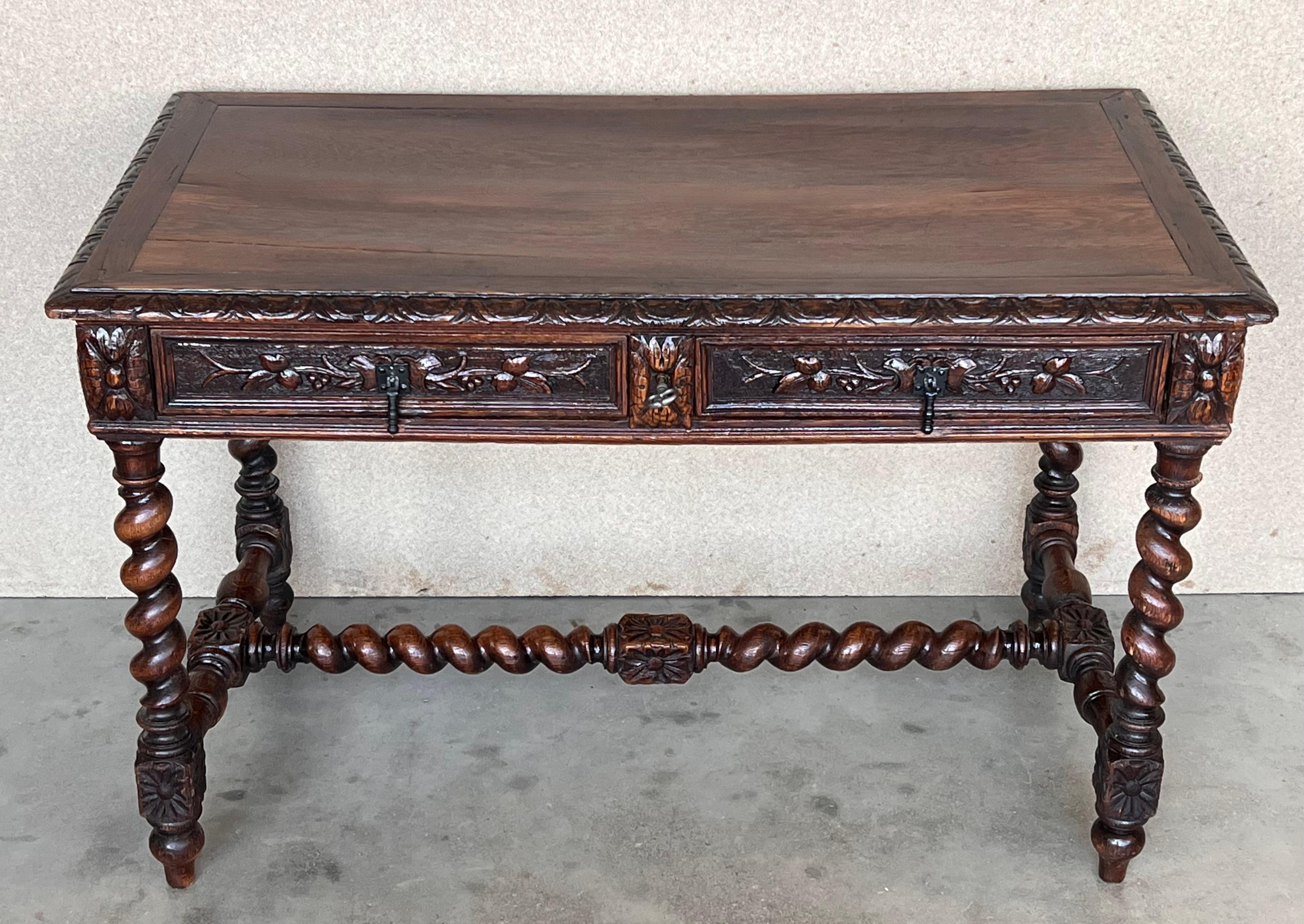 Spanish colonial Baroque walnut turned legs table with carved stretcher, exquisite antique hand carved Solomonic legs and carved frame. This gorgeous Fratino table features a rectangular top with beautifully carved foliate details over a base. Four