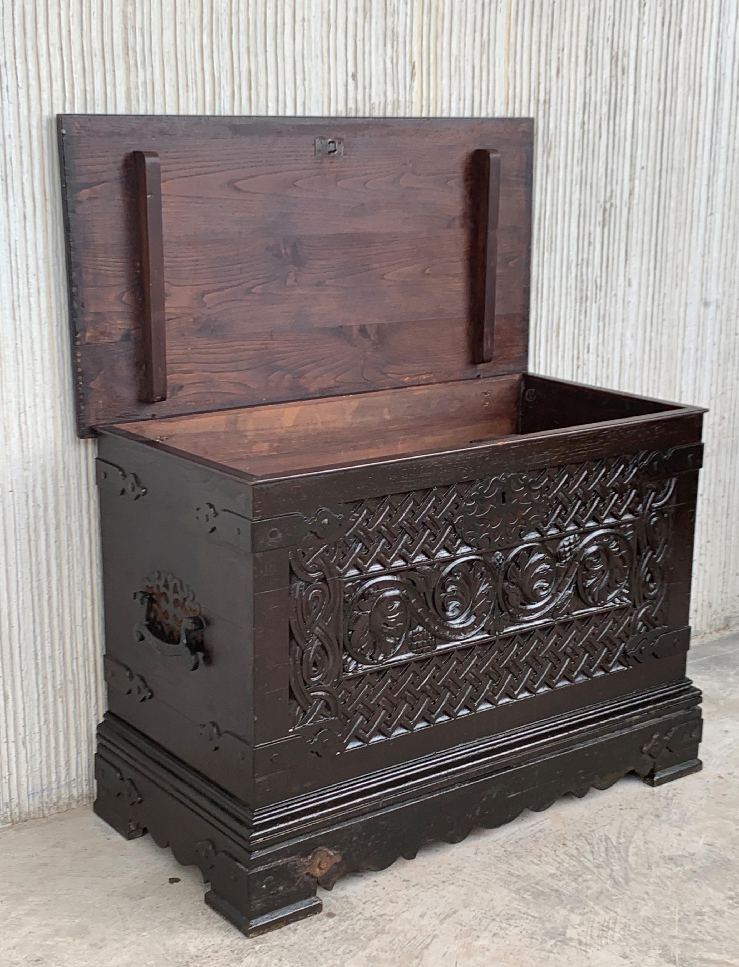 Iron 19th Spanish Baroque Walnut Trunk with Handcarved Decoration For Sale