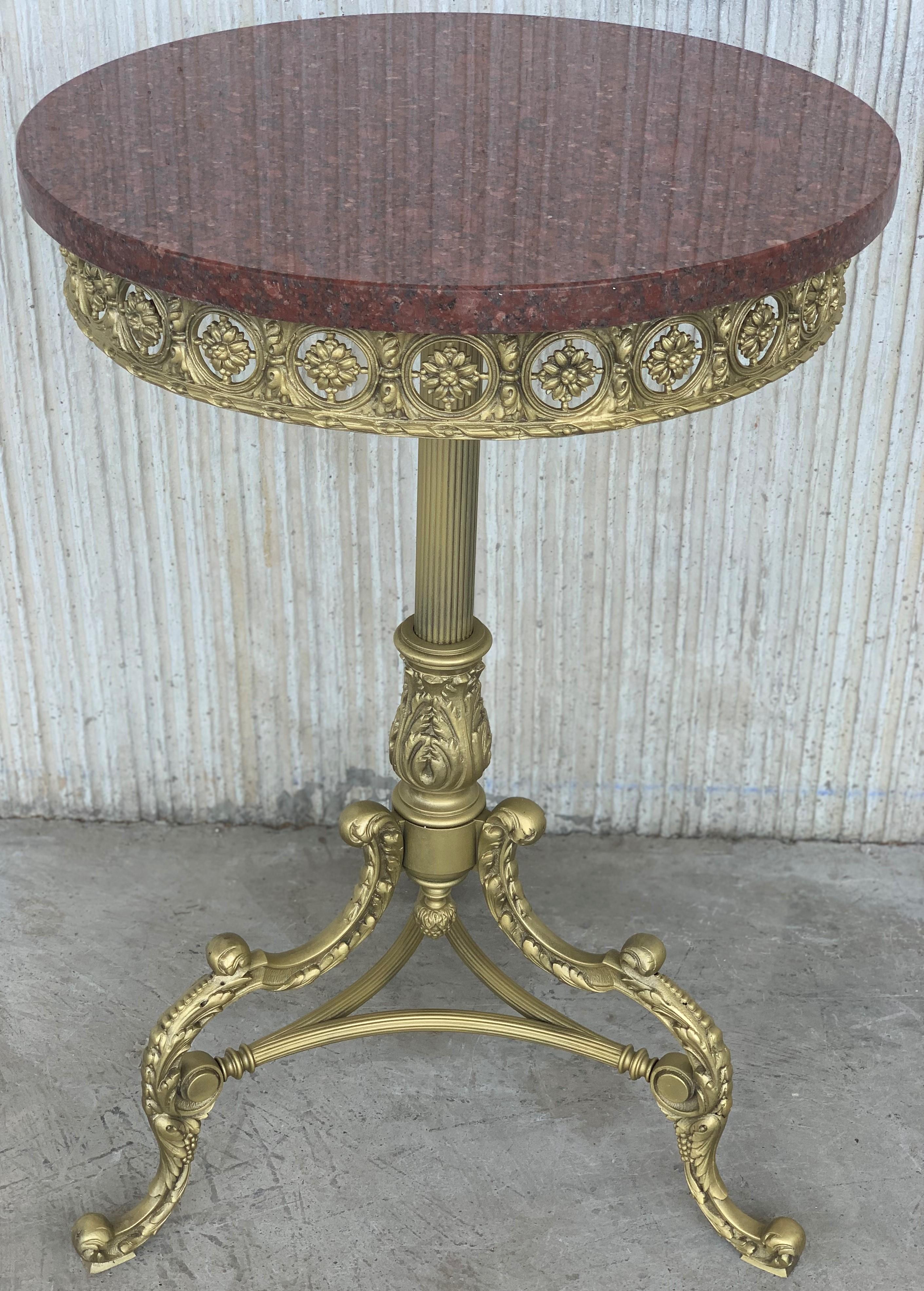 19th Spanish bronze and brass gilded side table with red marble top
Beautiful bronze reliefs in the base of the top and ornamental motifs in the three pedestal leg