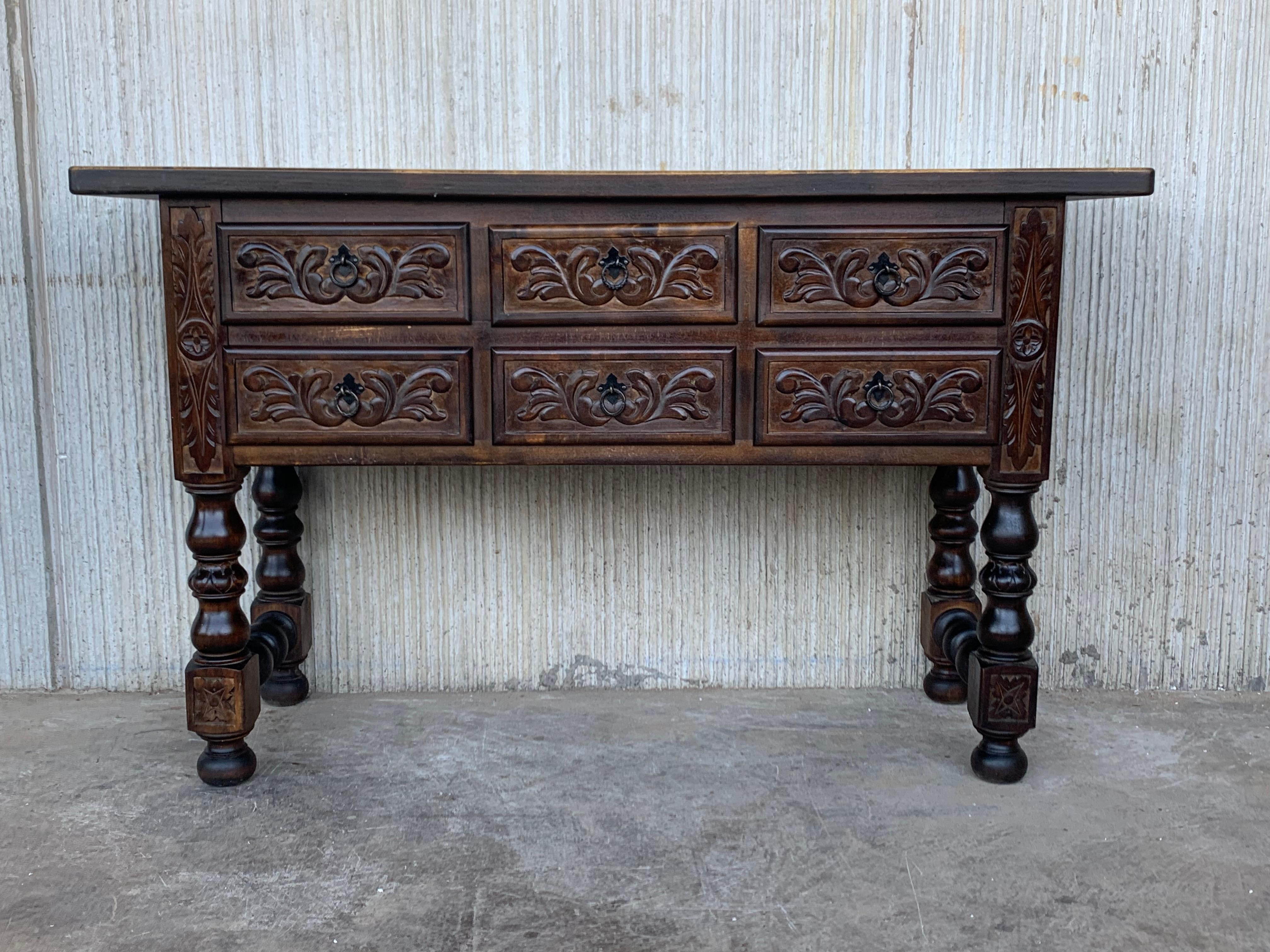 19th century Spanish carved walnut console sofa table with six drawers. You can use like a commode or chest of drawers This elegant antique walnut console was crafted in Spain, circa 1900. The sofa table with four legs features a six carved drawers