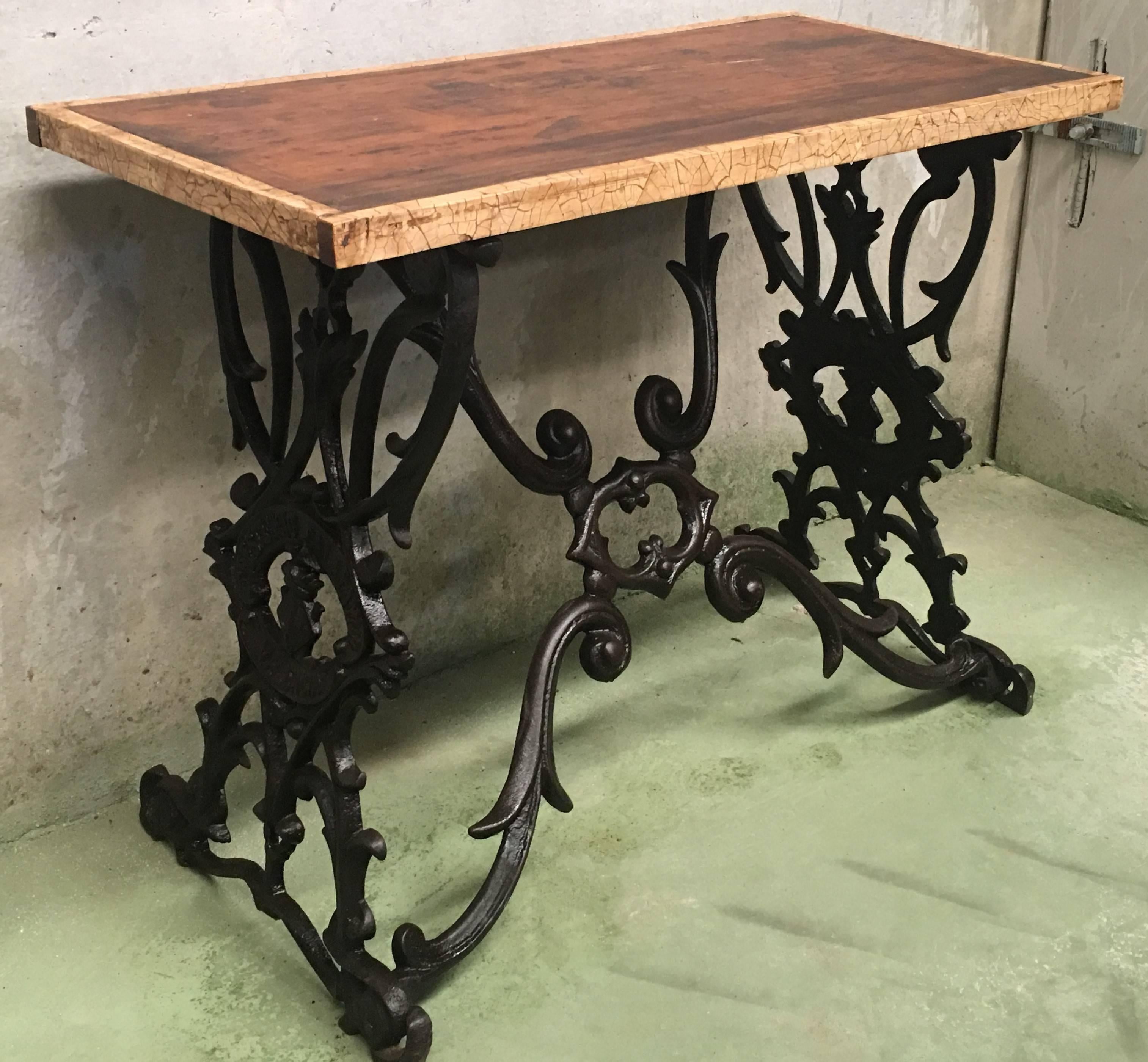 Beautiful antique 19th Spanish cast iron bistro or garden table with original wood top table.
Signed by Crescencio Calatayud, Valencia, Spain.