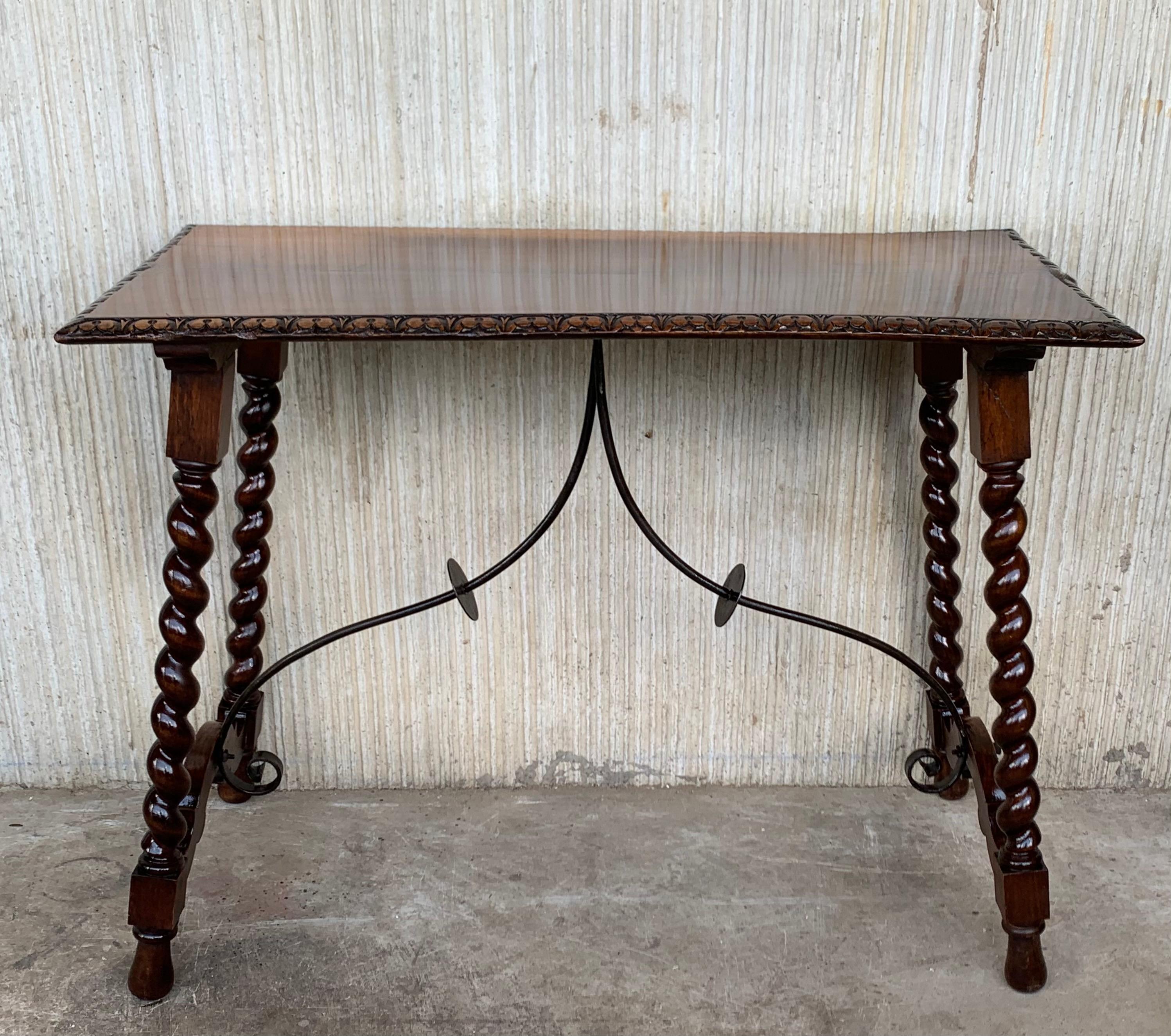 19th century Spanish console table with beautiful and rare iron stretcher. The rectangular top has carved edges, the end legs has a beautiful carved.
The measure is very rare because you can use like a desk, side table, vanity.
Beautiful carved