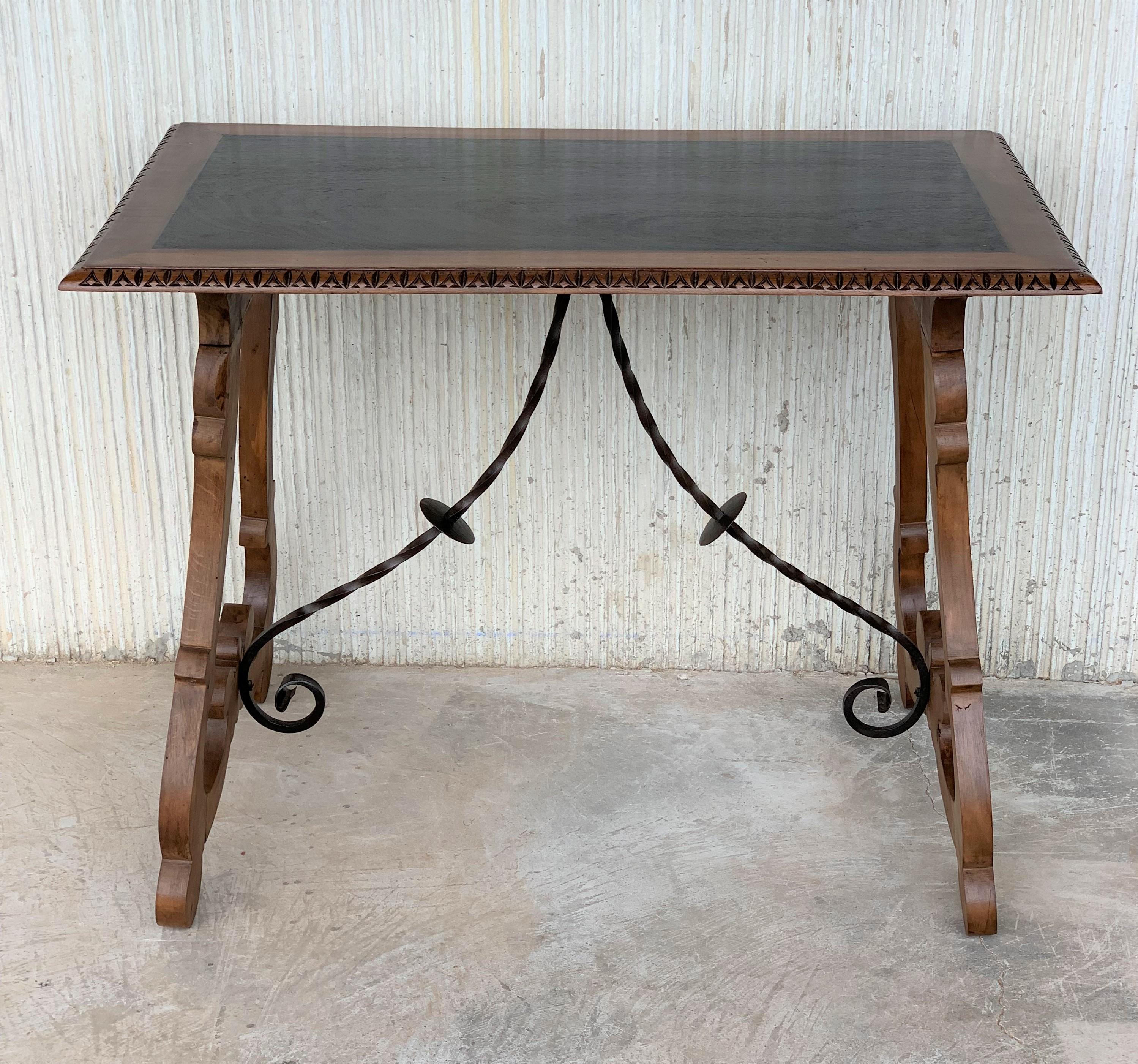 Spanish Colonial Spanish Farm Table with Iron Stretchers and Hand Carved Top and Ebonized