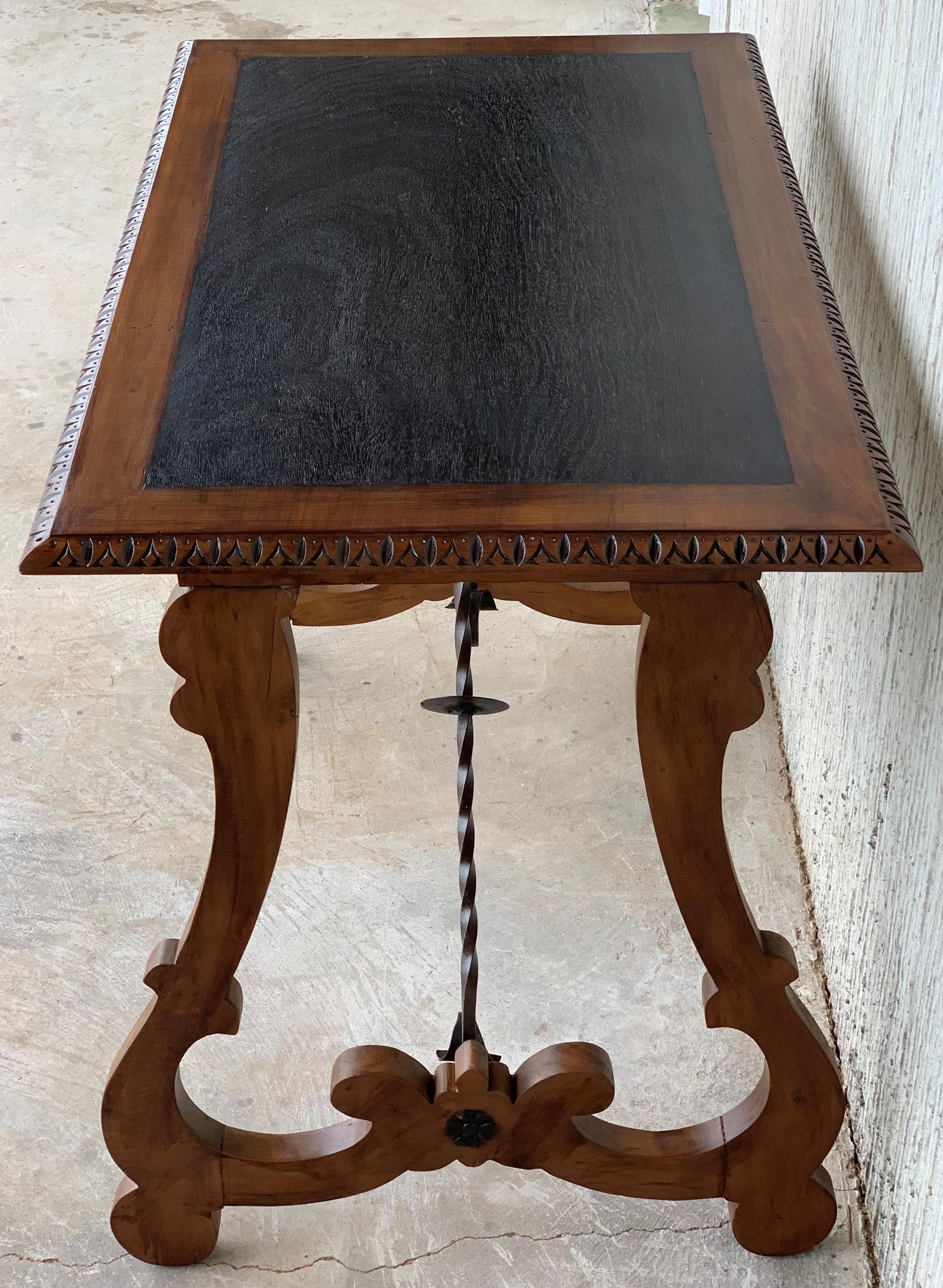 Hand-Carved Spanish Farm Table with Iron Stretchers and Hand Carved Top and Ebonized