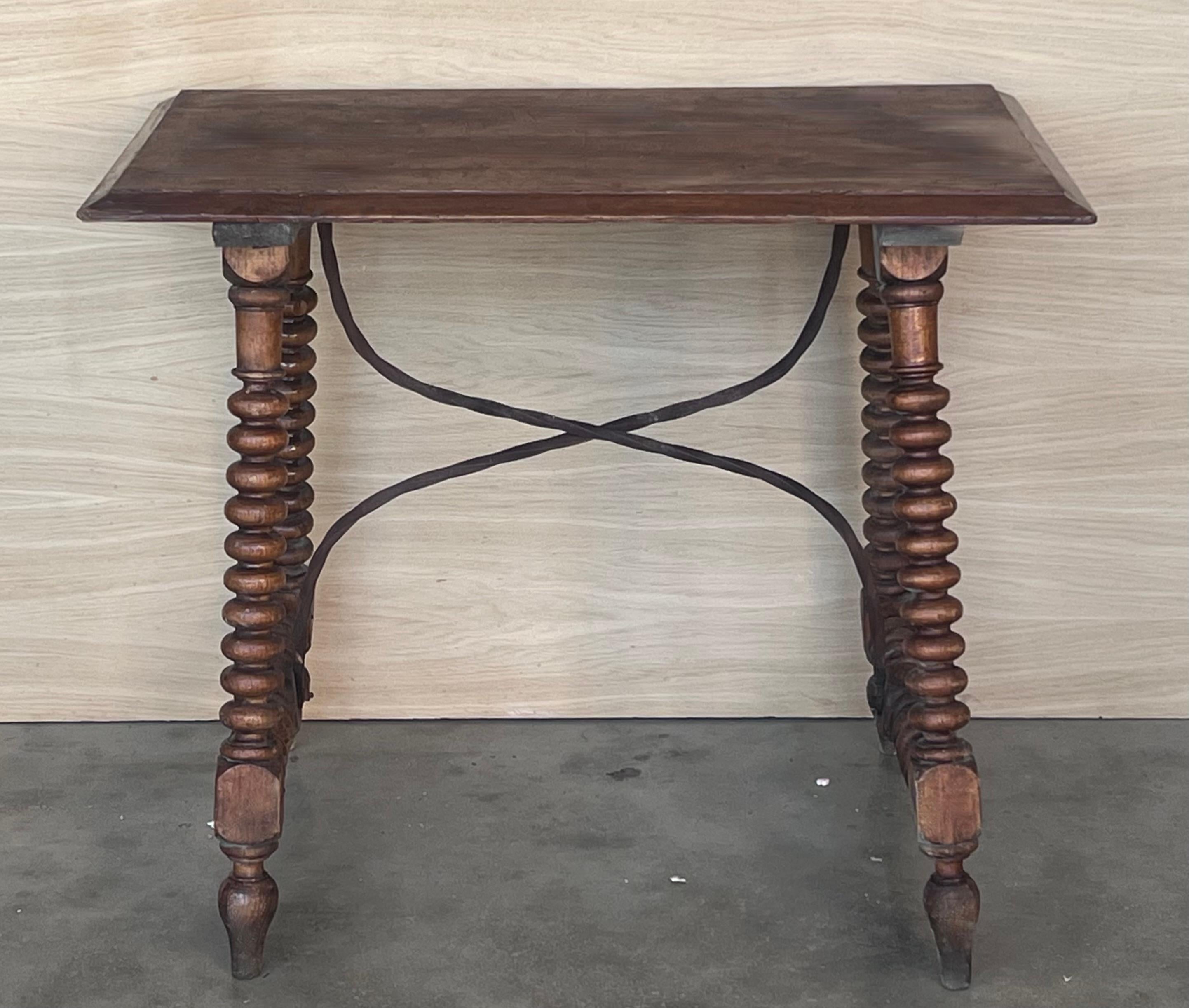 19th Spanish side table with turned legs and iron stretcher.
The top has a beautiful grain and patina.