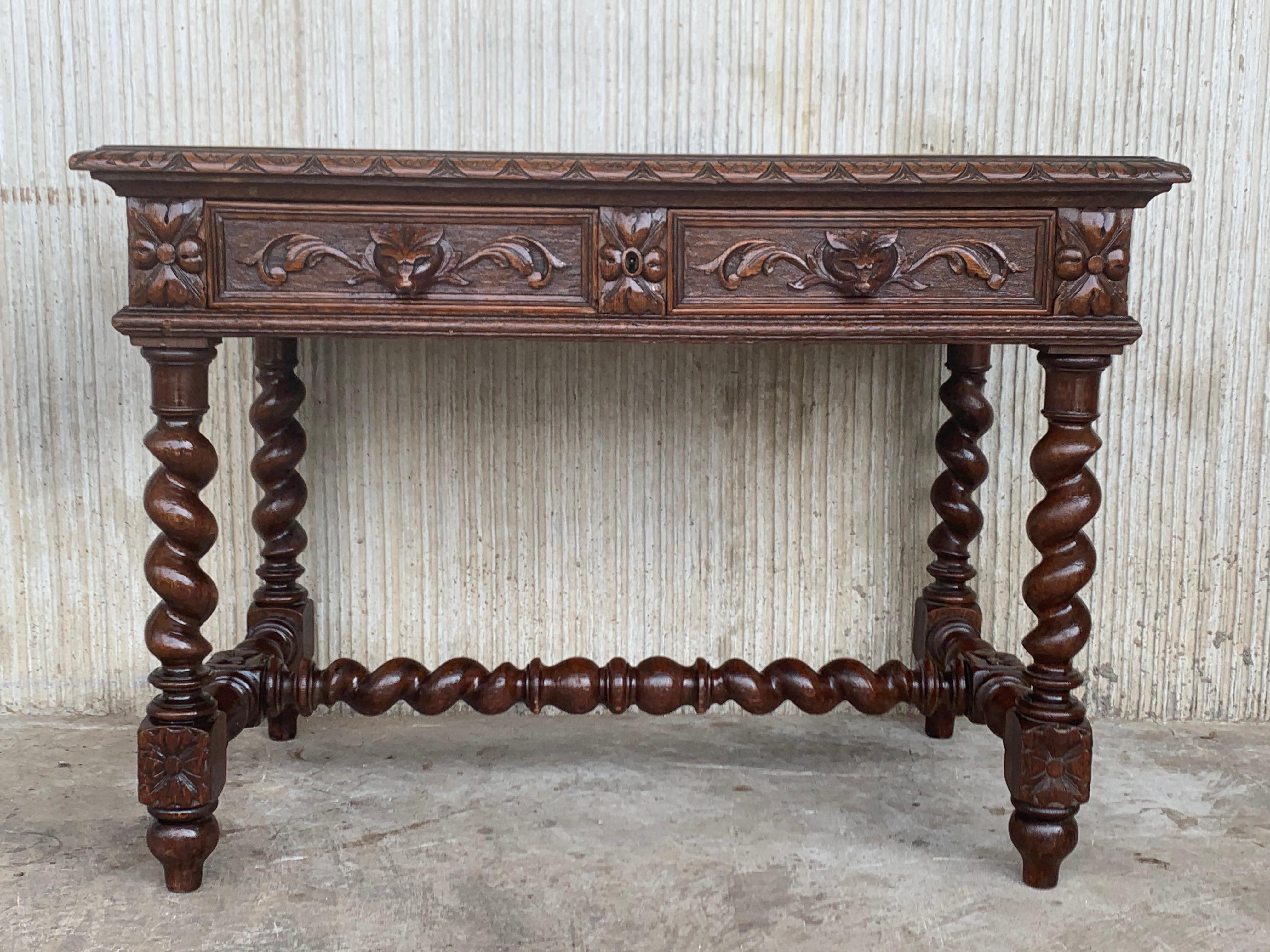 19th Spanish walnut desk with two drawers and solomonic turning legs and solomonic stretcher
it is carved in four sides
It has a central lock for both drawers and carved wood fox like a handles

Height to the floor to the drawers 25 in.
  
