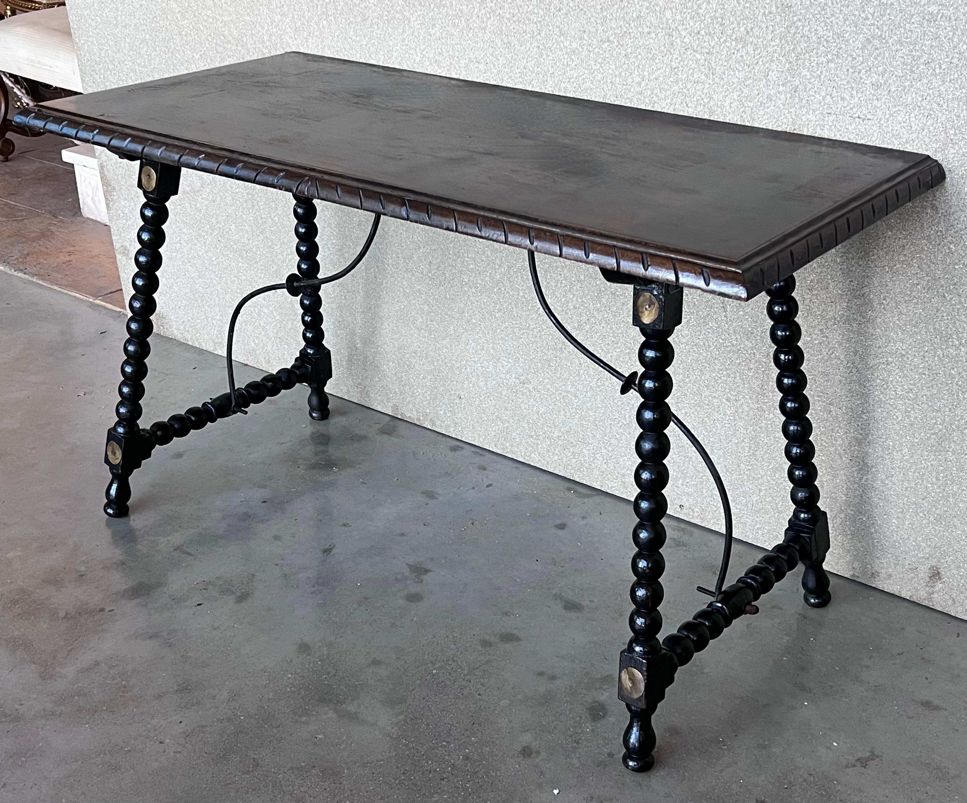 Carved 19th Spanish Walnut Side Table with Turned Legs and Iron Stretcher For Sale