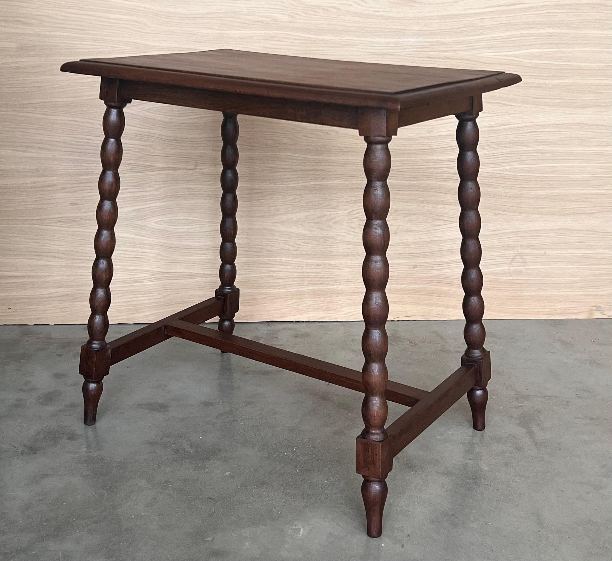 Carved 19th Spanish Walnut Side Table with Turned Legs and Iron Stretcher For Sale