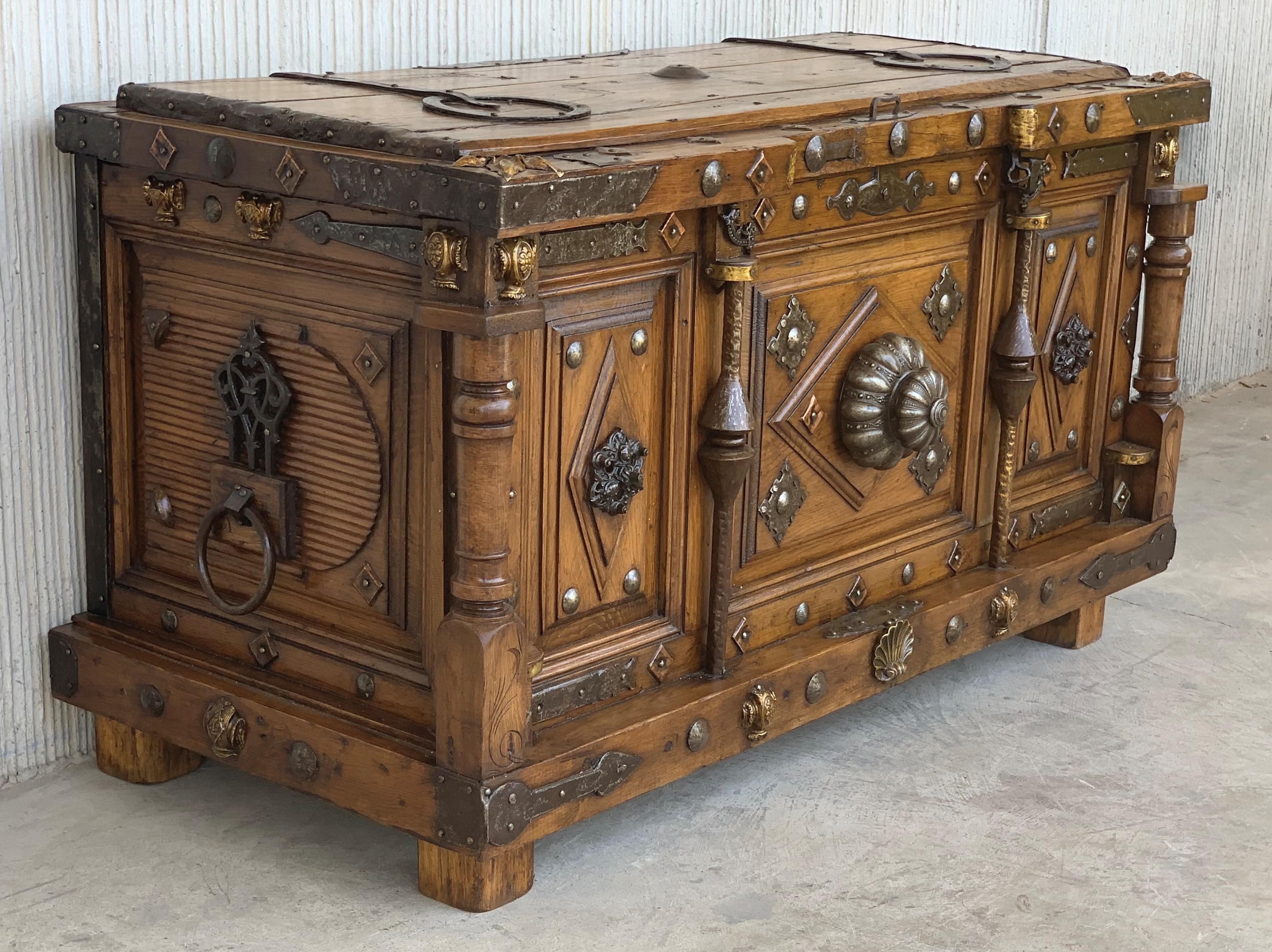 Store blankets or other bedding in this beautiful antique walnut trunk. Crafted in Castilia, Spain, circa 1880, this blanket chest makes a visual statement no matter the room it is in. The top cabinet is embellished with bronze decorations and