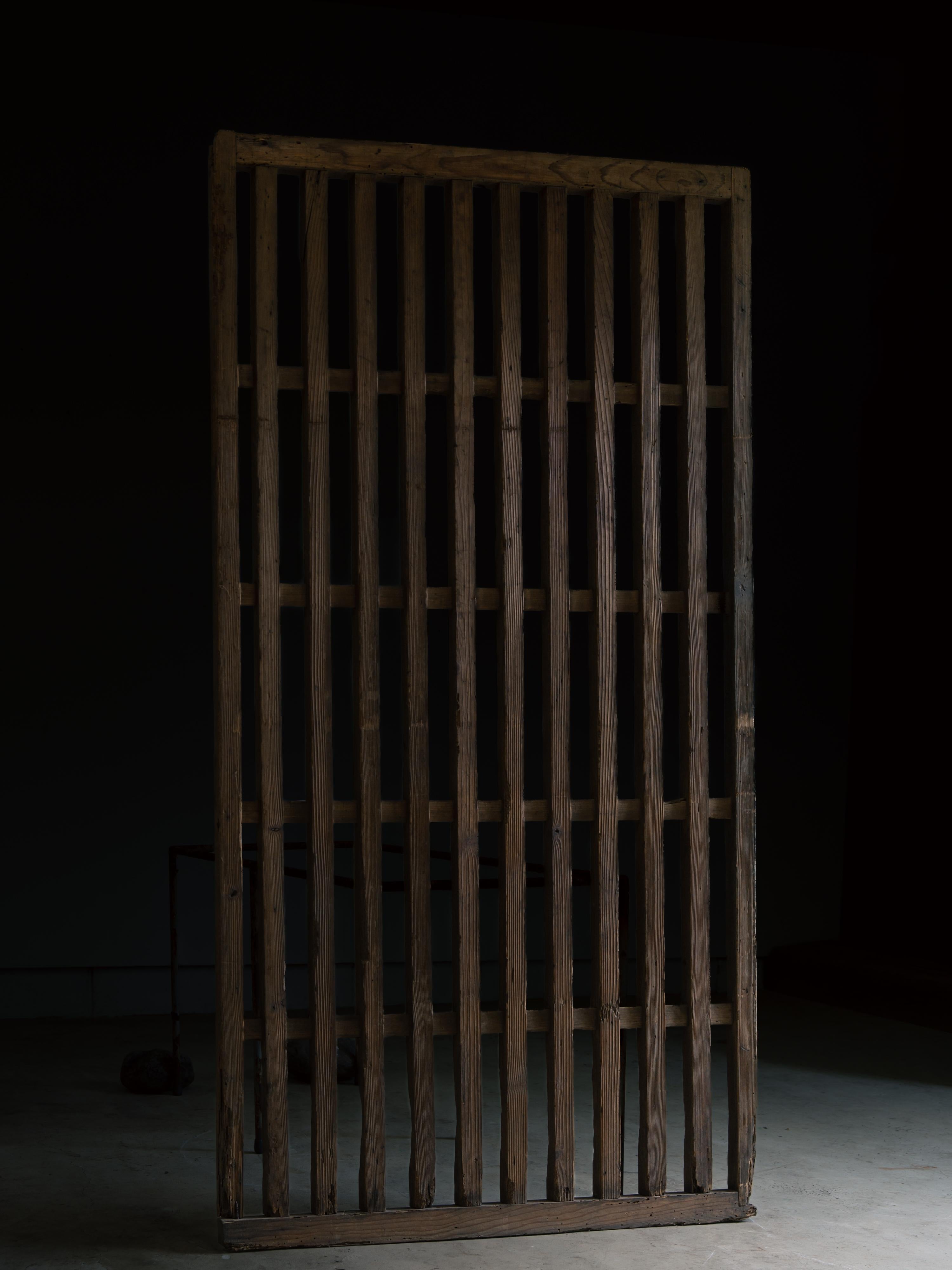 Edo 1860s-90s wabi sabi Japanese thick black sliding lattice door, exterior door in vendita