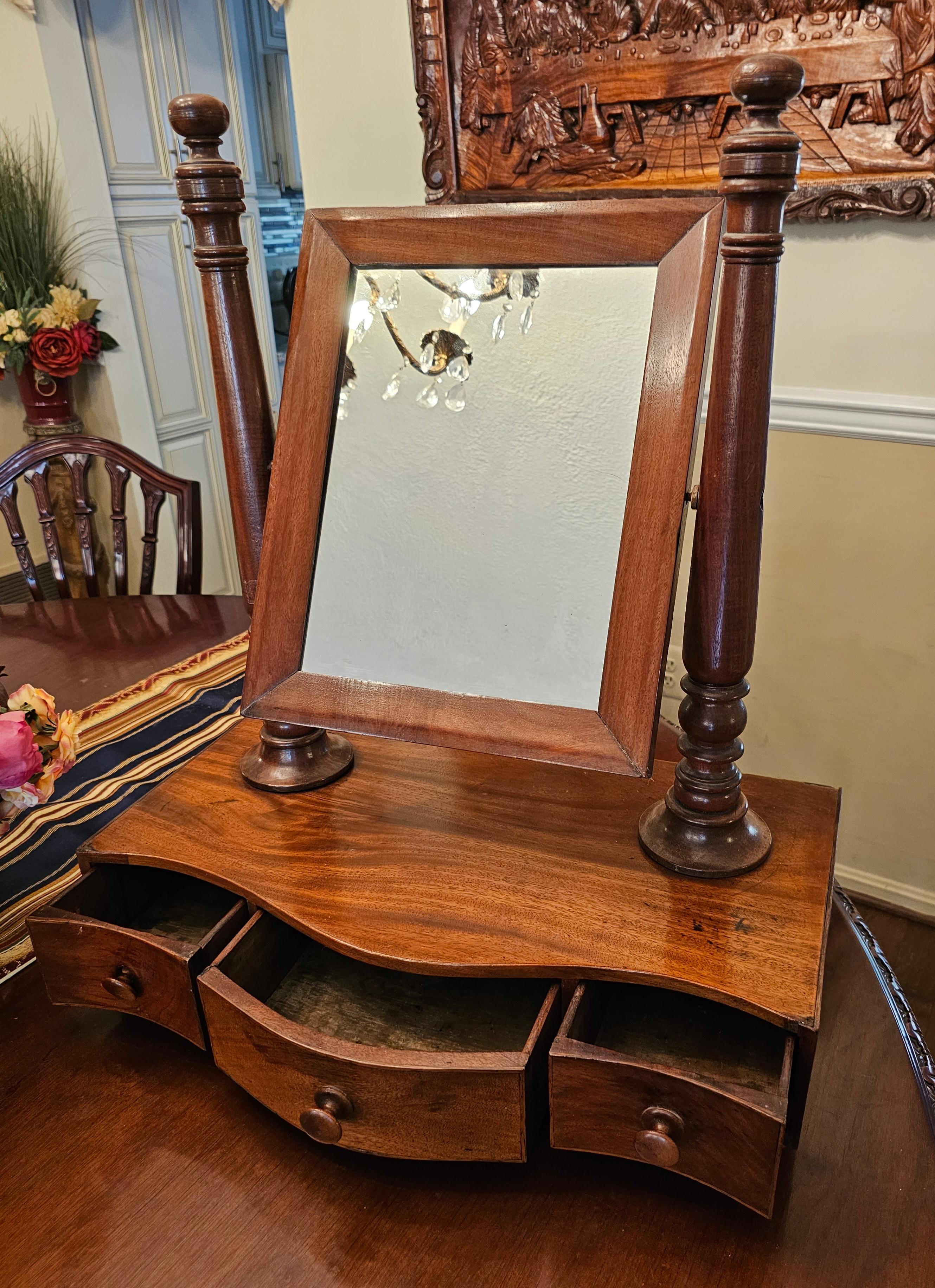 A 19th Victorian Mahogany Shaving Mirror or dress mirror to go on the table or on the Chest. Mirror comes apart for easy handling
Measures 21.75