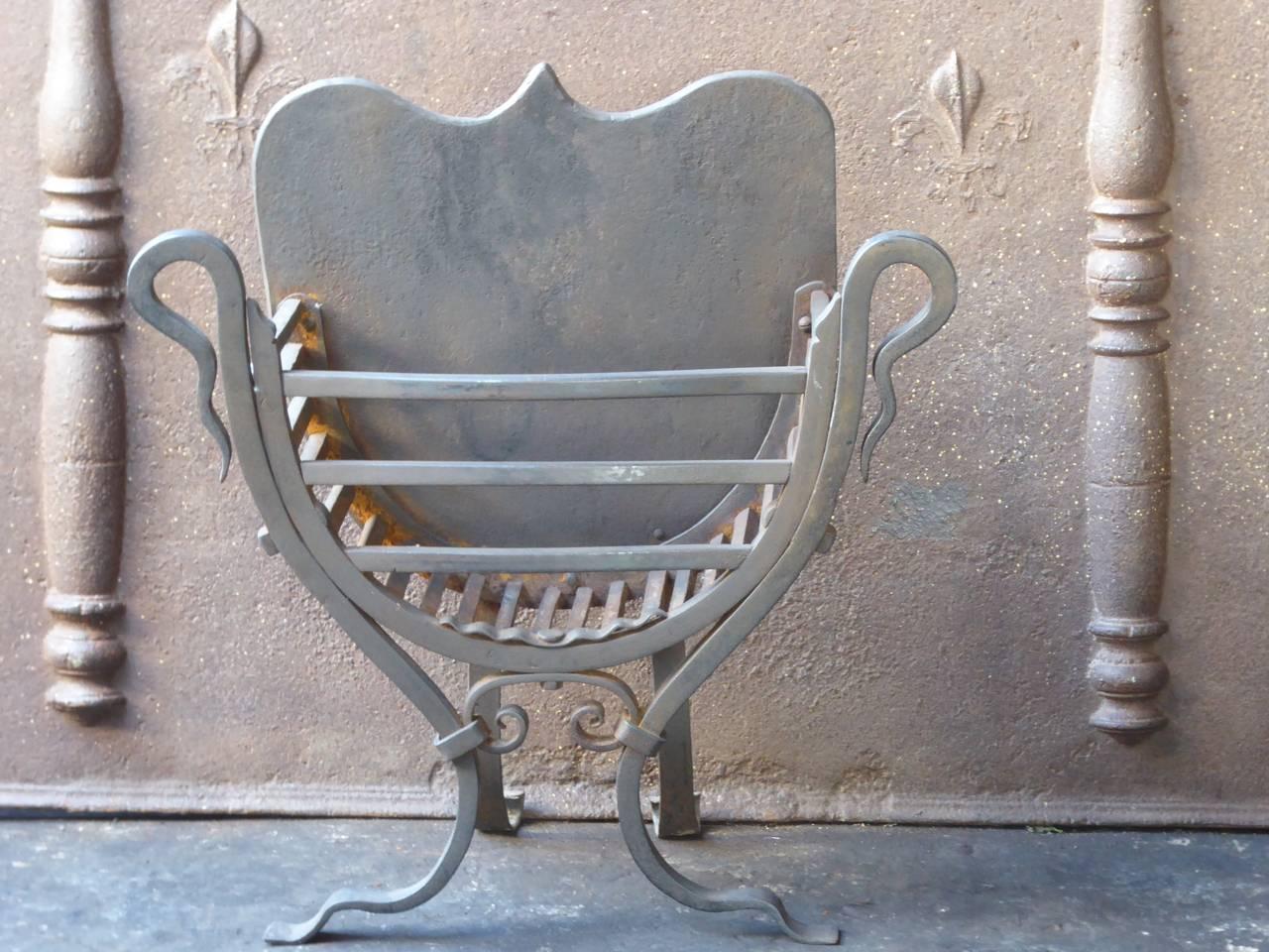 19th-20th century English Victorian fireplace basket, fire grate made of wrought iron. The total width of the front of the grate is 56 cm.

We have a unique and specialized collection of antique and used fireplace accessories consisting of more than