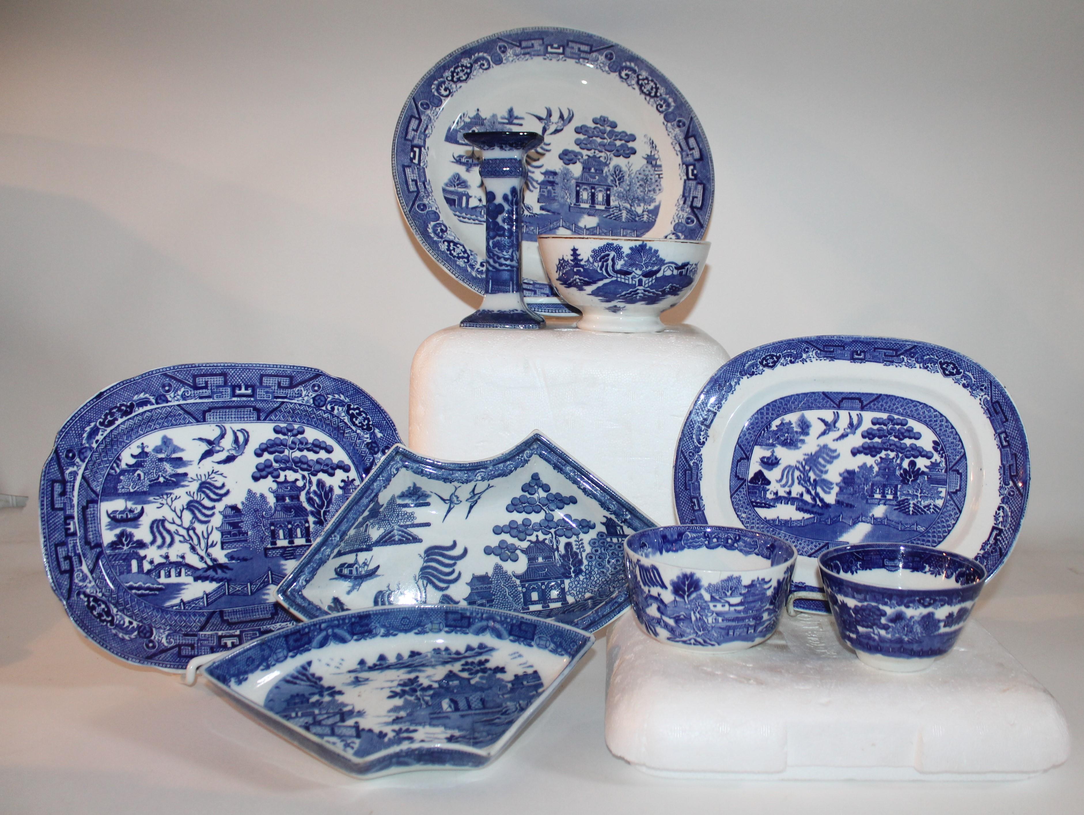 This collection of various blue willow dishes are all in good condition and are all English made pieces. Sold as a group.

Measures: Smaller platter 10 x 8 x 1
Larger platter 11 x 9 x 1
candle holder 3 x 3 x 11
Dish 12.5 x 1
rice bowl large 6