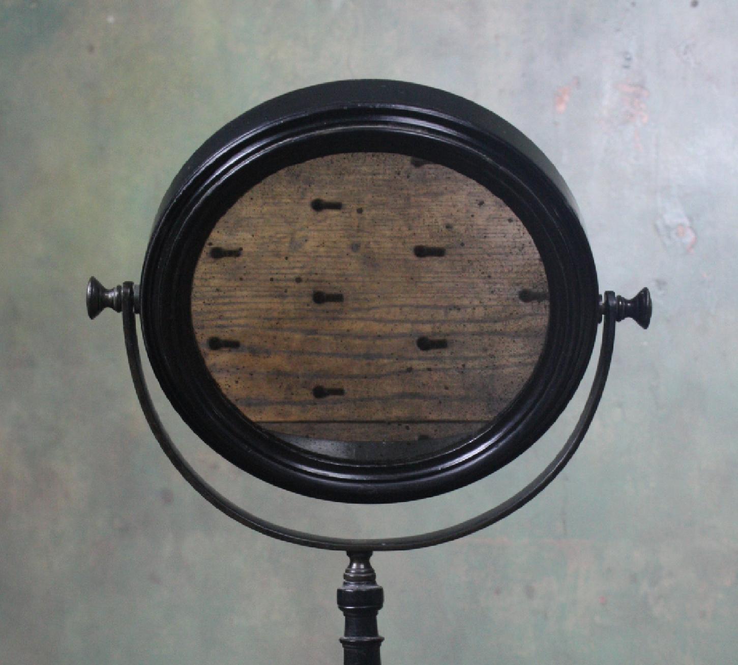 A scientific optical doubled sided mirror with one concave mirror plate the other flat 

These where used in studies of optical sciences and in particular the study of the properties of light rays,

circa 1880s in age, English in origin