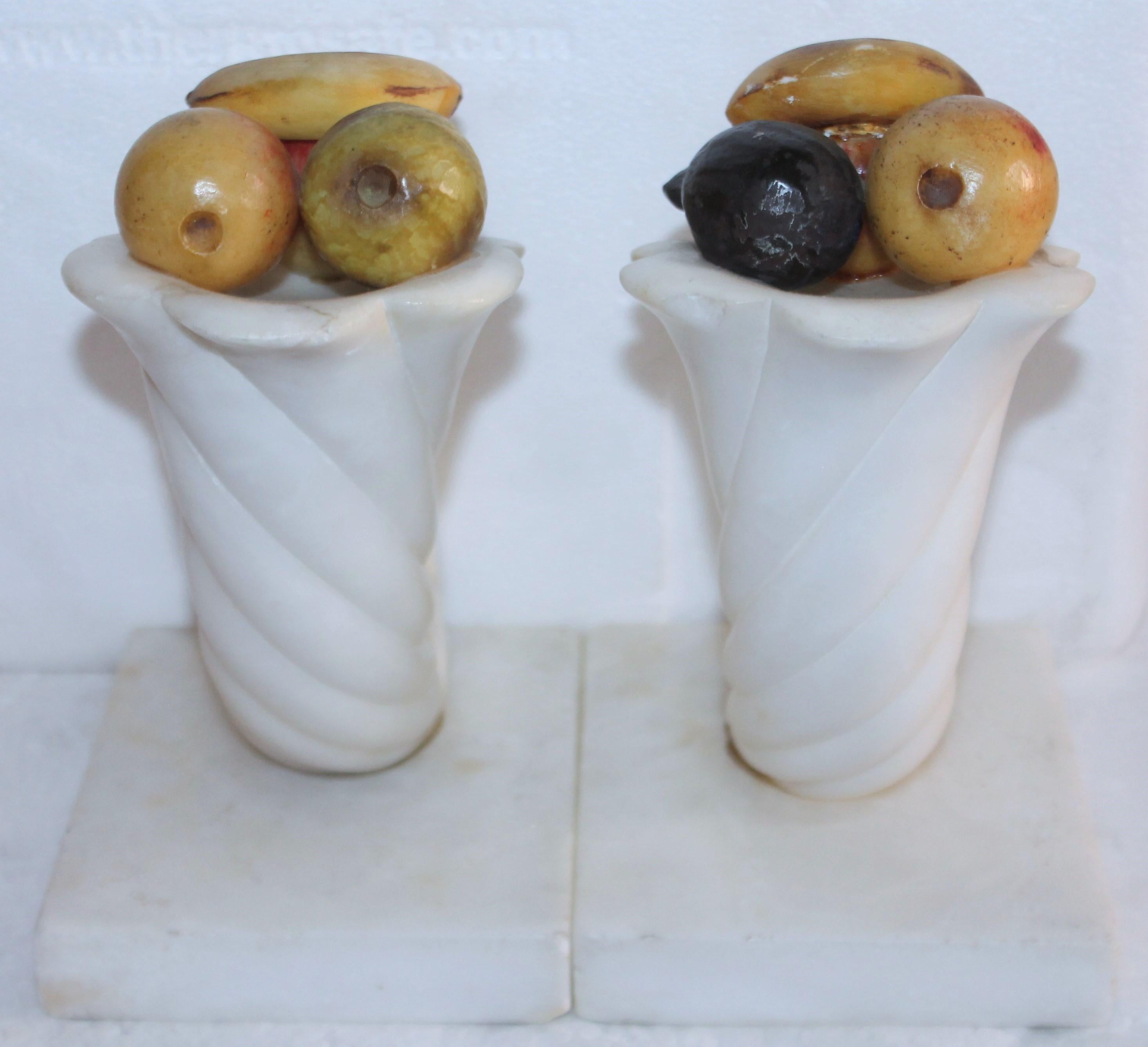 19th century Alabaster cornucopia bookends with painted mini alabaster fruit. The condition is very good.
