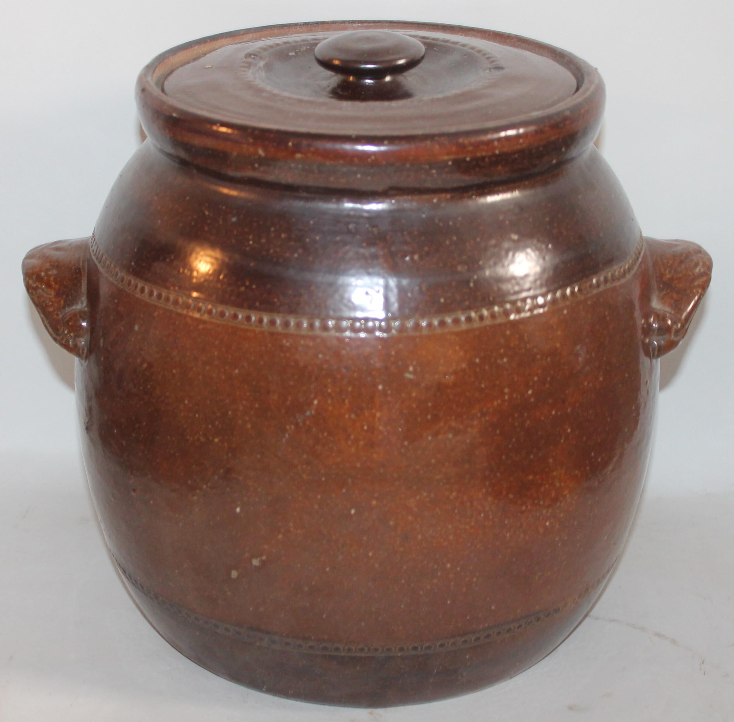 This 19th century handmade pottery very large bean pot is in great condition and has a wonder aged patina glaze.