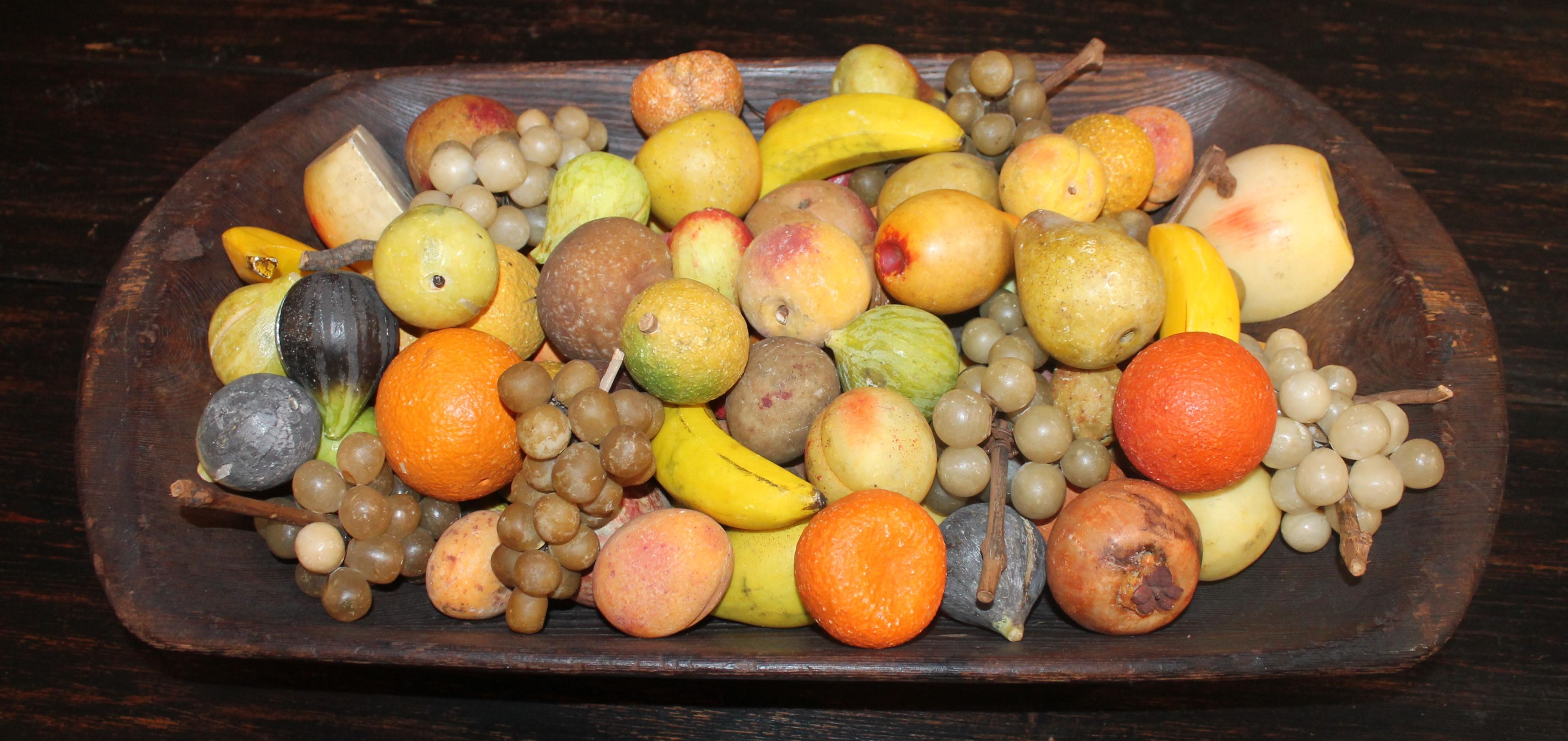 This fine hand carved and painted dough bowl is in great condition and is filled with vintage stone or 
original painted alabaster fruit. Many grapes, figs, walnuts, cherries, plums, peaches, bananas, oranges, tangerines, lemons and limes. Its an