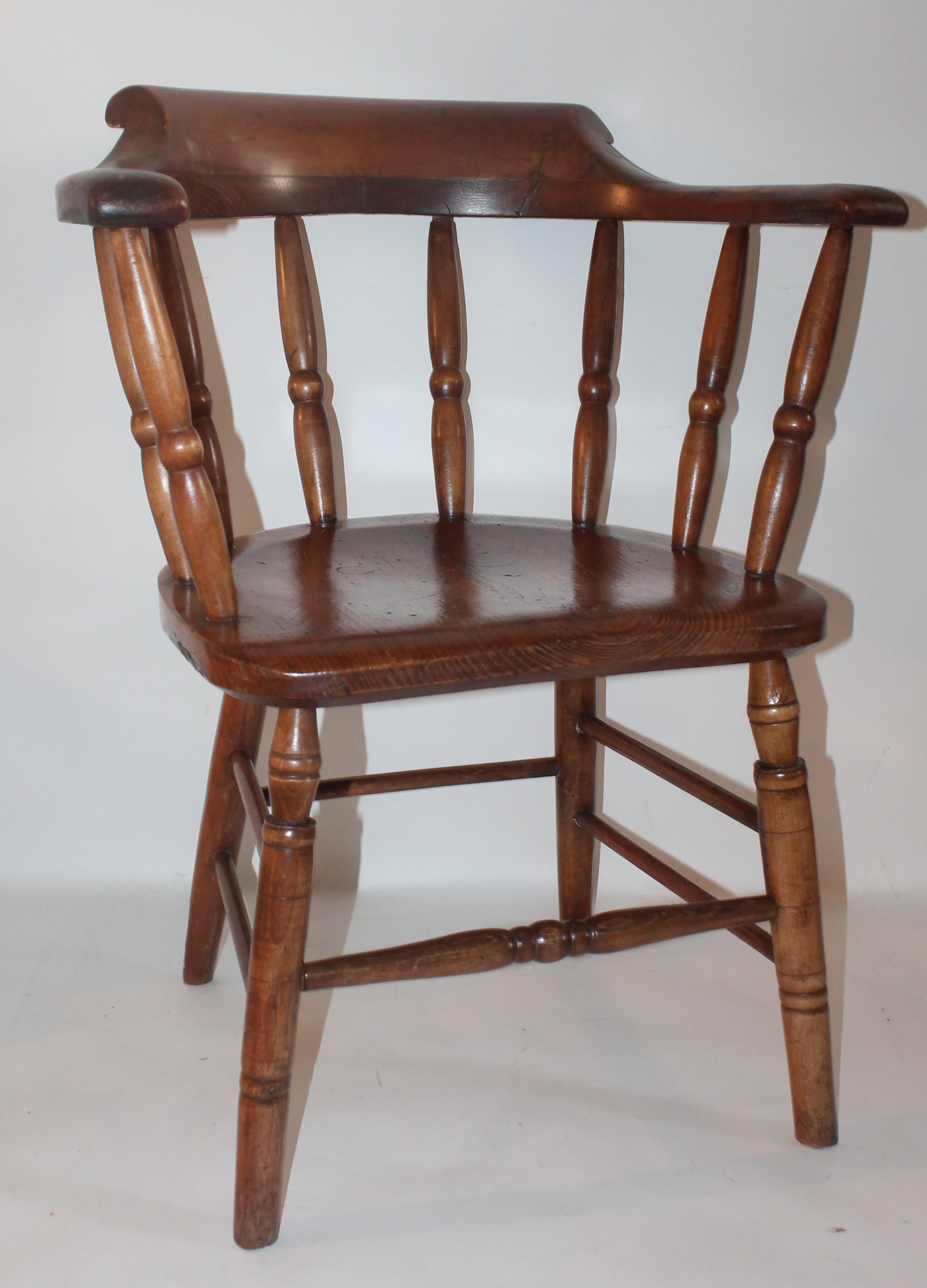 These fine New England pine captains chairs are in great condition and very strong and sturdy. These country captains chairs were often used in the old saloons and pubs in New England. They are in a old refinished or varnish and stain surface.