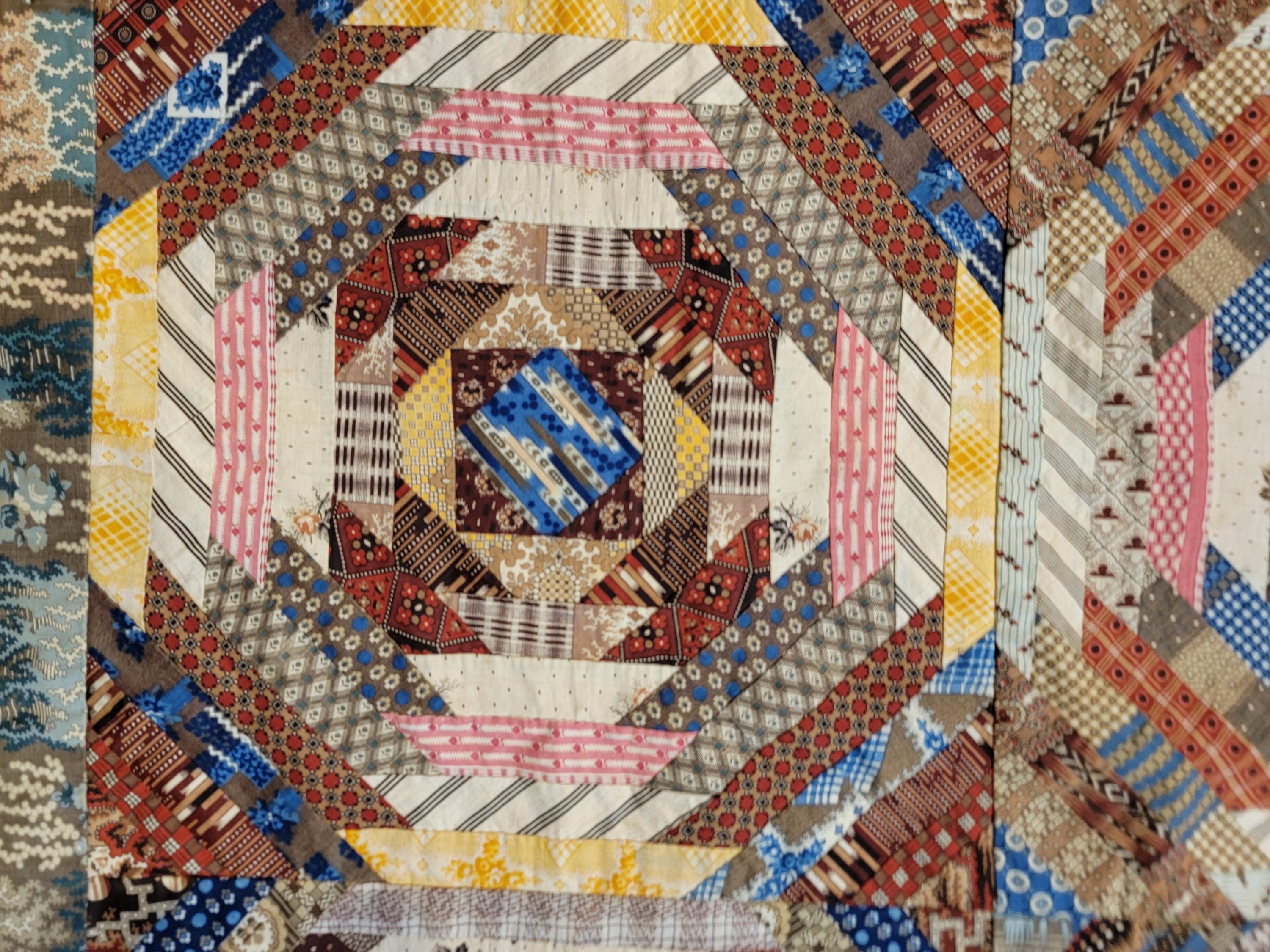 This amazing early 19thc Pine Apple log cabin quilt is in amazing condition. It was gifted in 1883 and signed : To Larrissa From C.A.G. 1883. The quilt contains fabric from 1800-1840 it is so spectacular and in amazing condition.