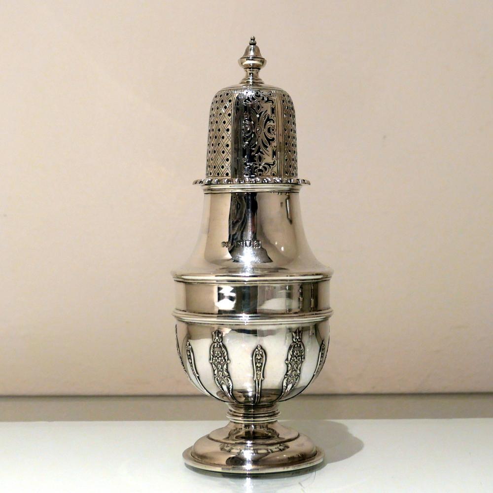 A stylish Victorian silver baluster formed sugar caster decorated with elegant strap work designs to its lower bowl. The removable top is elegantly decorated with a gadroon border and stylish hand piercing, 19th century.

 

Weight: 10.2 troy