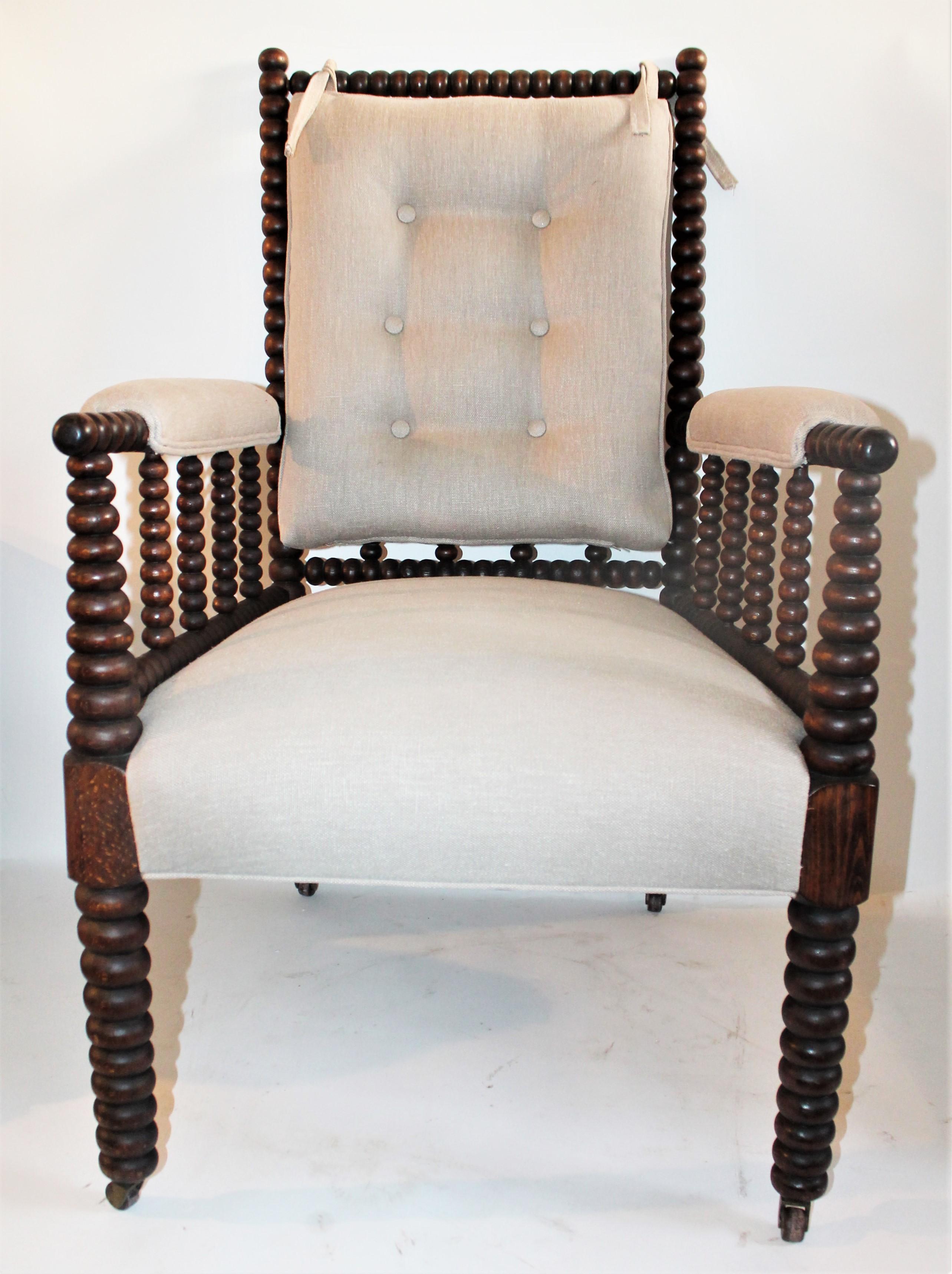This 19th century Barley twist spool side chair is in fine condition and has a removable back cushion in linen. This chair is done in a fine thick cotton linen fabric and freshly upholstered. This chair is super comfortable.