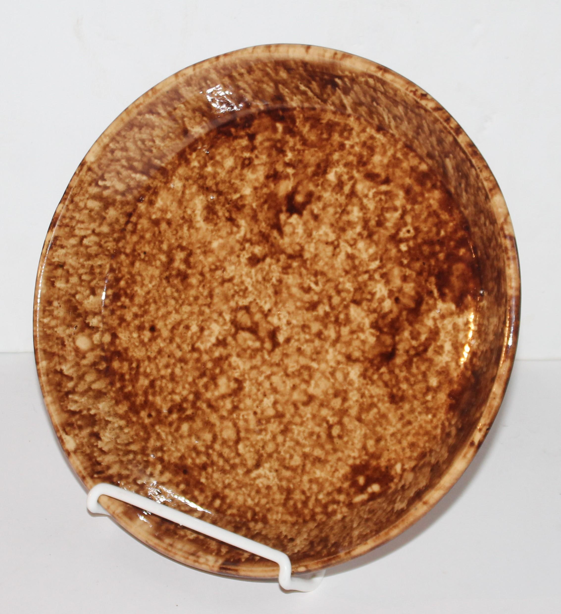 This 19th century Rockingham or Bennington sponge pie plate is in pristine condition and very large in size. These large pie plates are very hard to find.