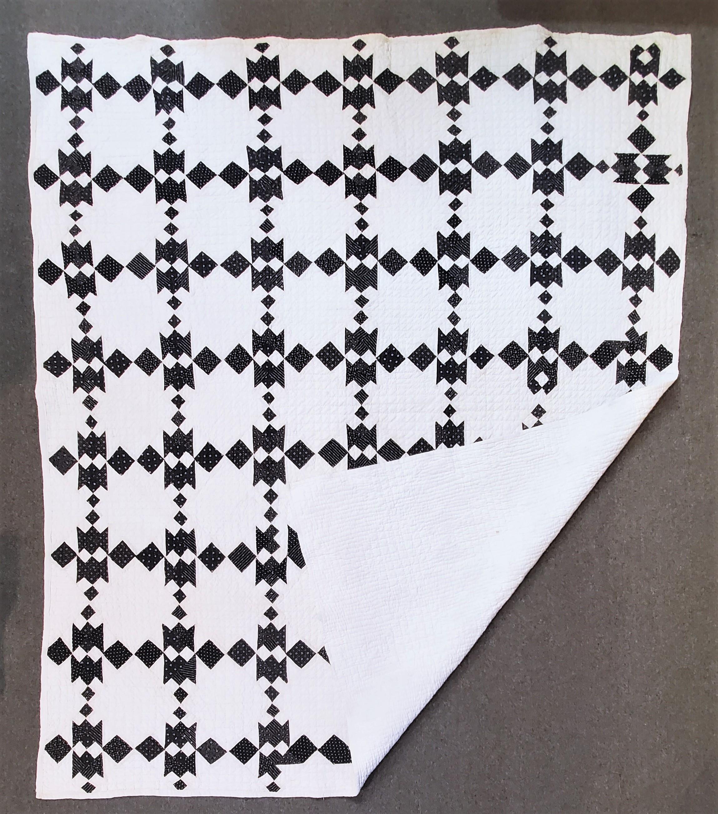 This fine very hard to find black and white 19th century geometric quilt is in good condition. The black and white calico quilts are so rare to find in such good condition.
