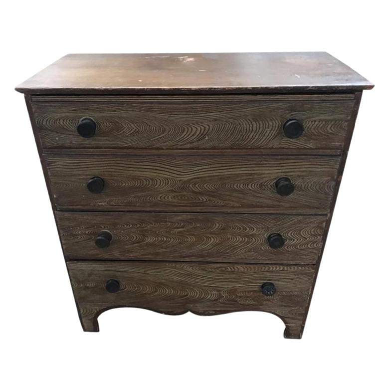 This early finely paint decorated tall blanket chest is in fine condition. The tall lift top chest has two top false drawers and all original drawer pulls. These brass patinaed drawer pulls are original. The construction is cut nails and dovetailed