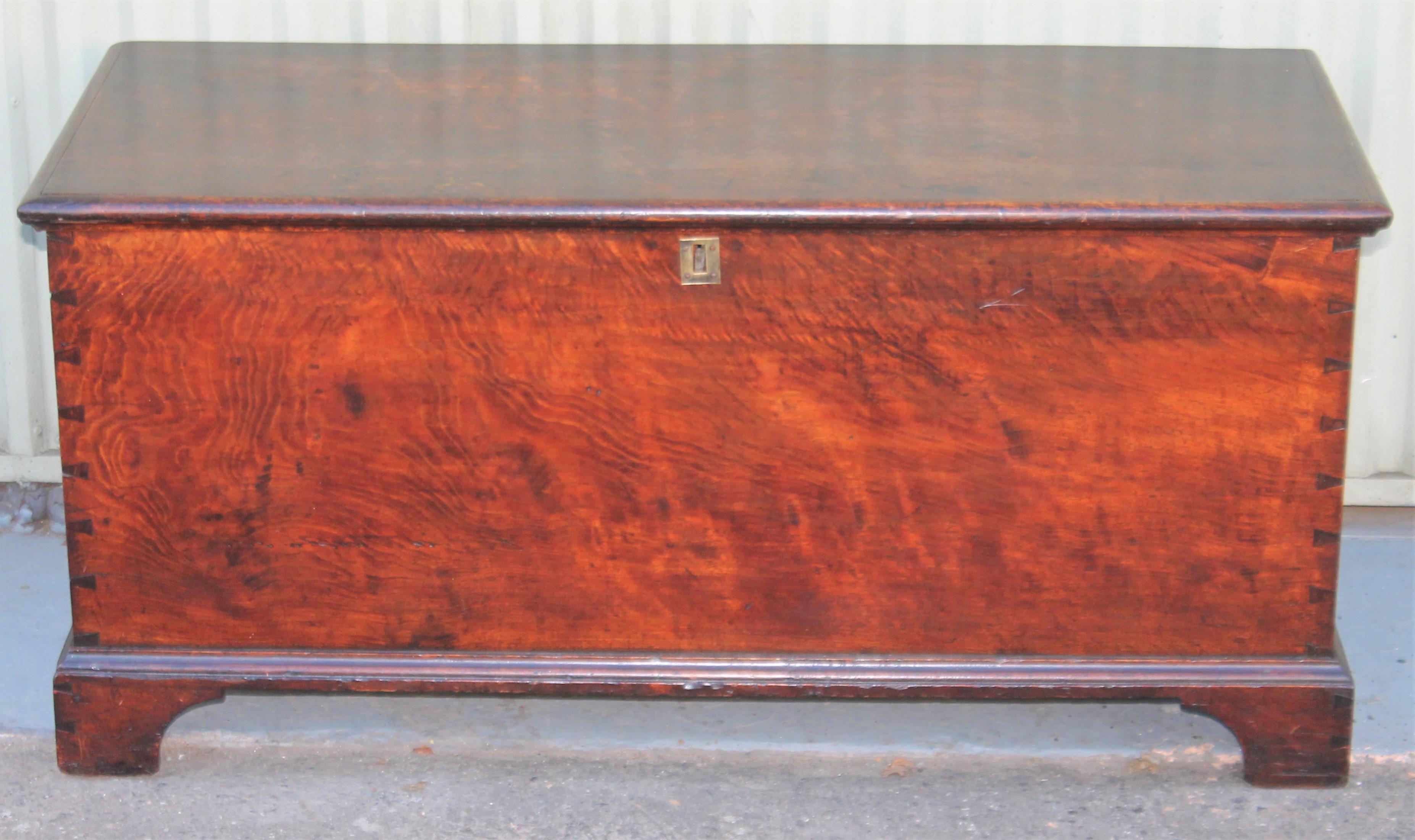 This fine and early 19th century walnut dovetailed blanket chest has an amazing old surface and in fine as found condition. The interior is very clean with a button box till and original brass key plate. It also retains the original hand forged
