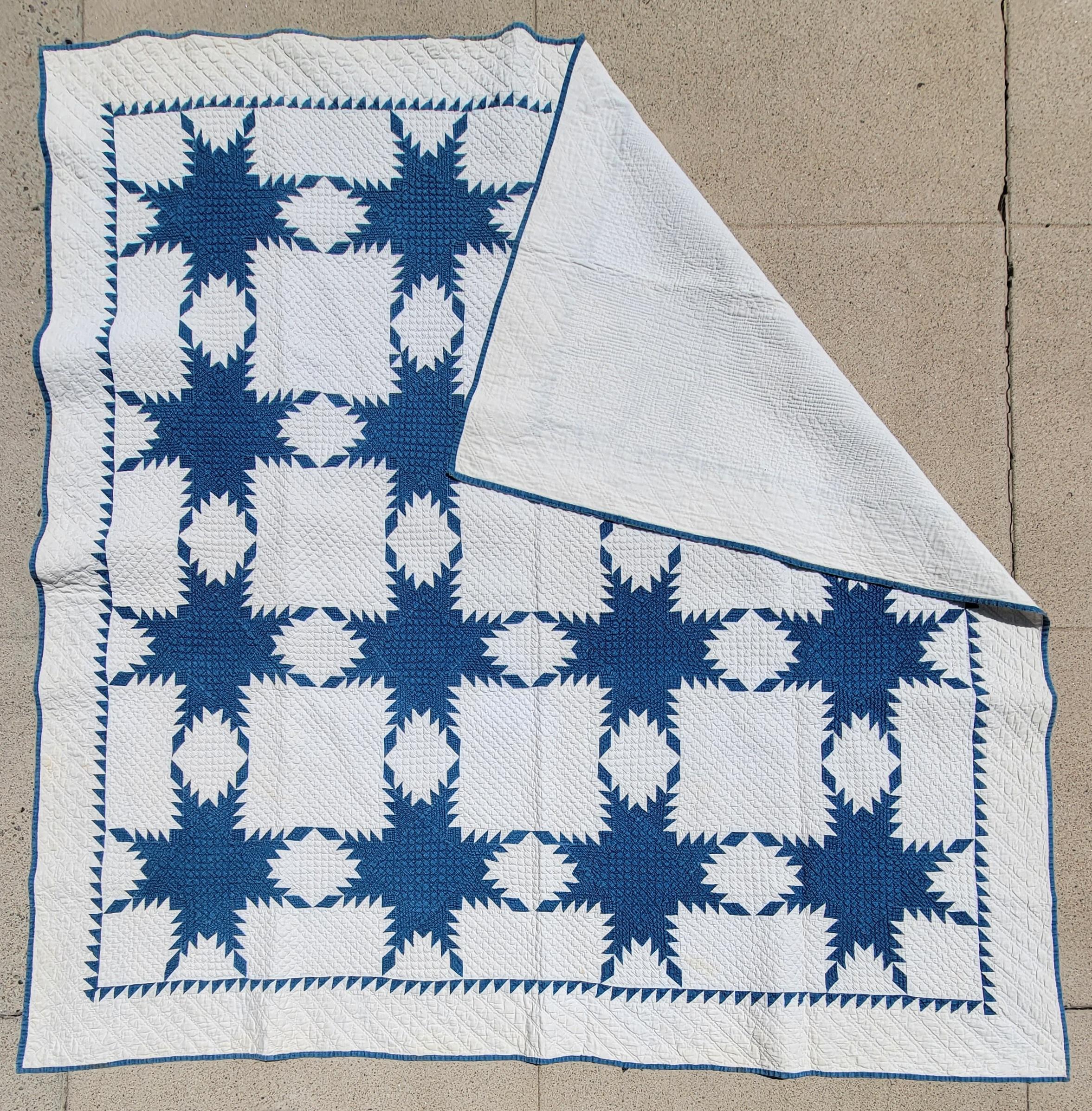 This finely hand quilted & pieced 19th century feathered star quilt has fine tight quilting and great small piecing. This quilt is in pristine condition and comes from a fine folk art & quilt collection. The condition is pristine and very graphic.